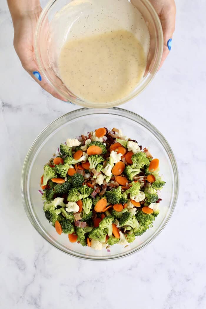 pouring dressing over broccoli mixture