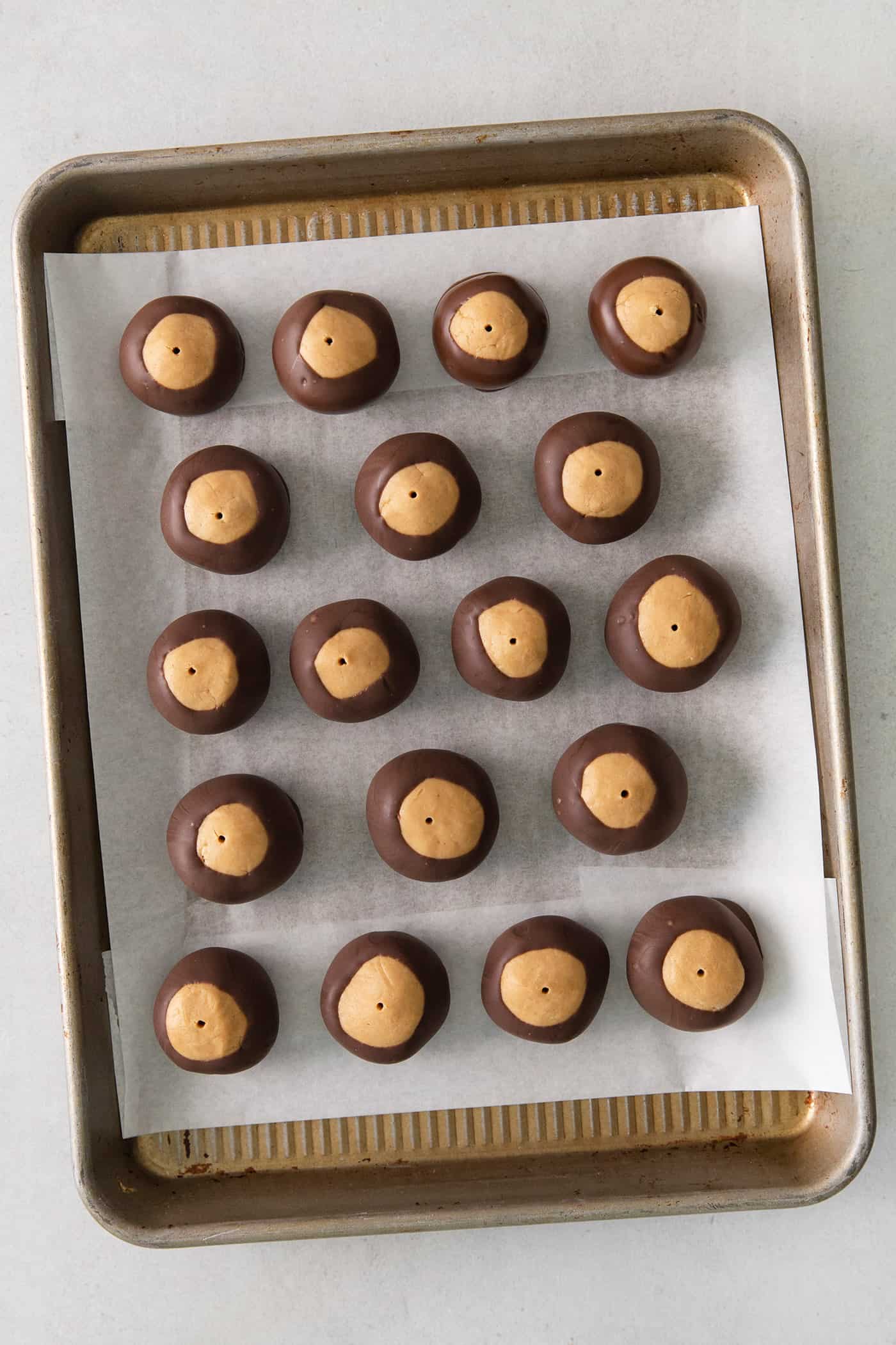 Overhead view of buckeye balls on a baking sheet