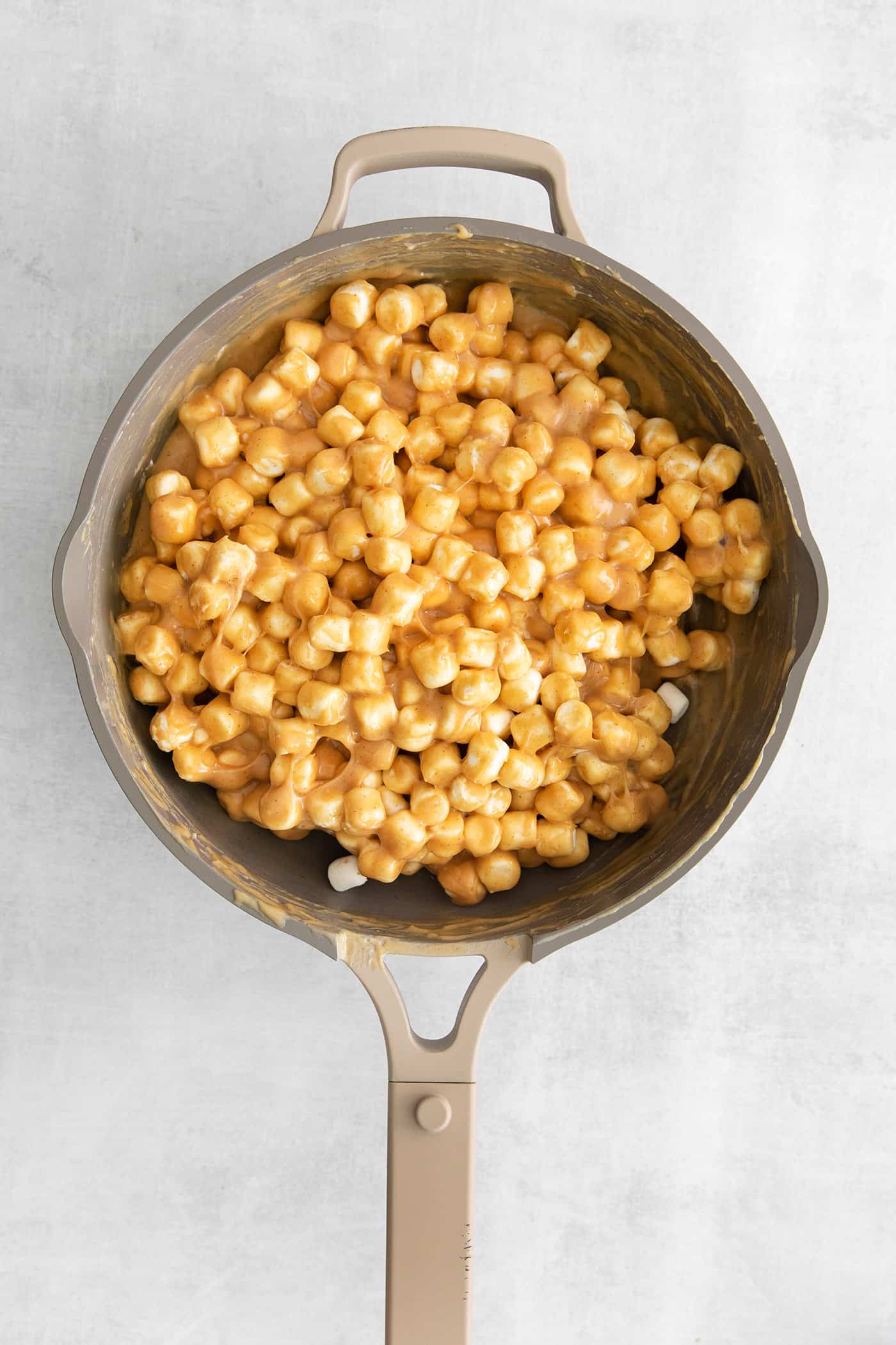 mini marshmallows in a pot, mixed with peanut butter mixture