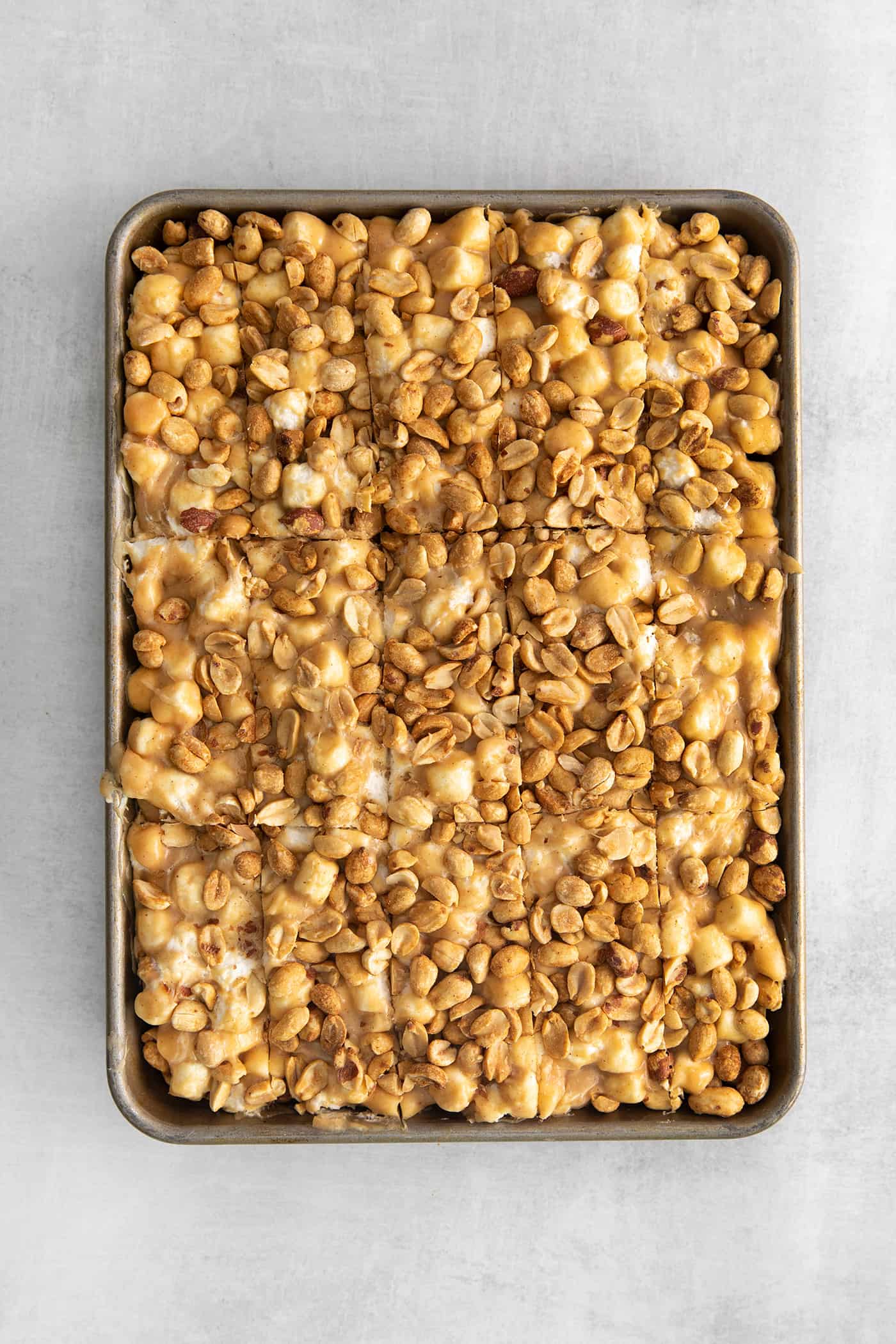 a pan of salted nut roll bars, sliced