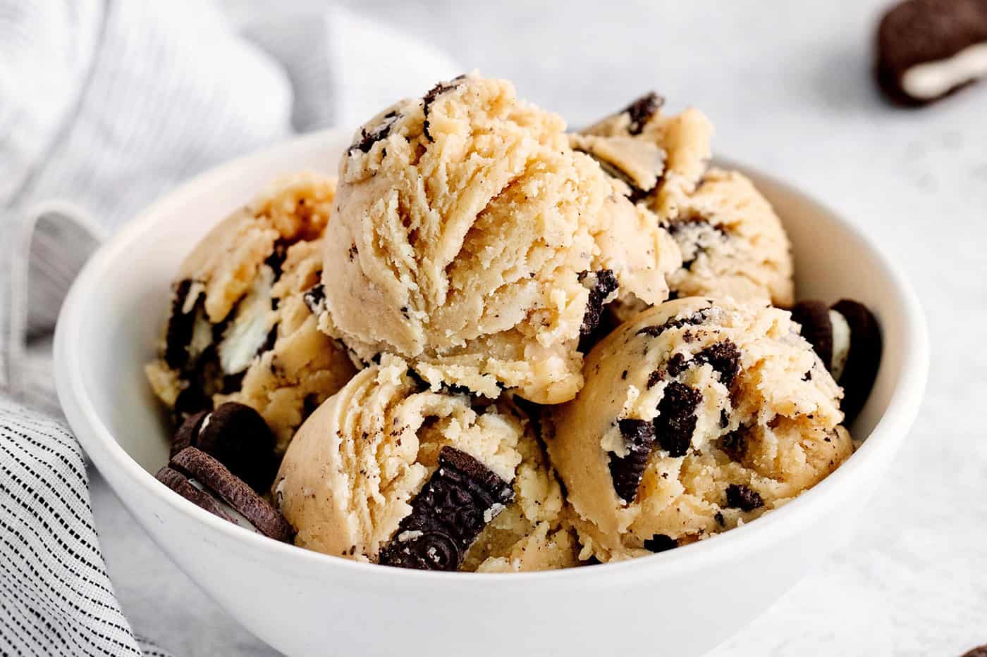 A bowl with scoops of edible oreo cookie dough