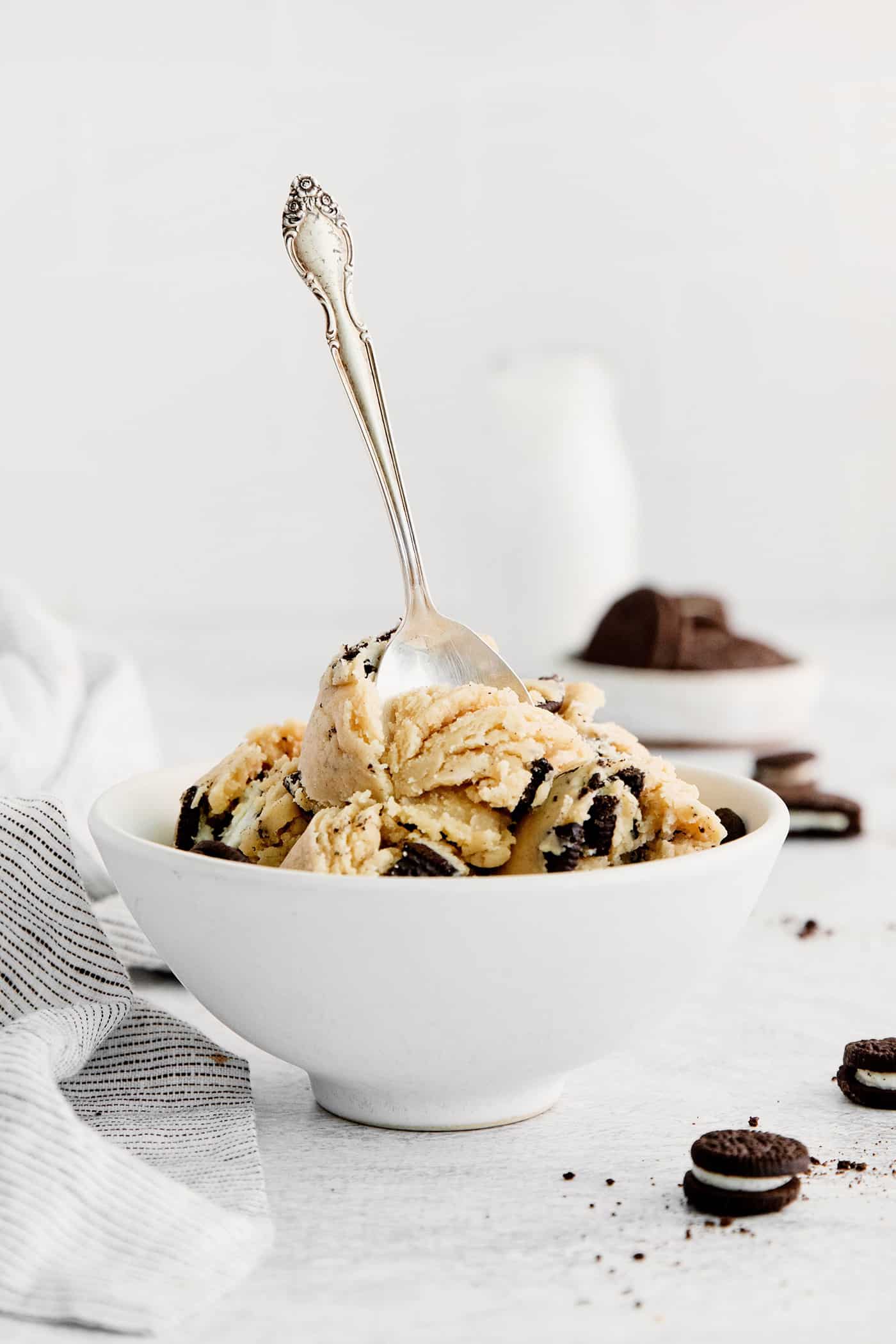 A spoon in a bowl of edible oreo cookie dough