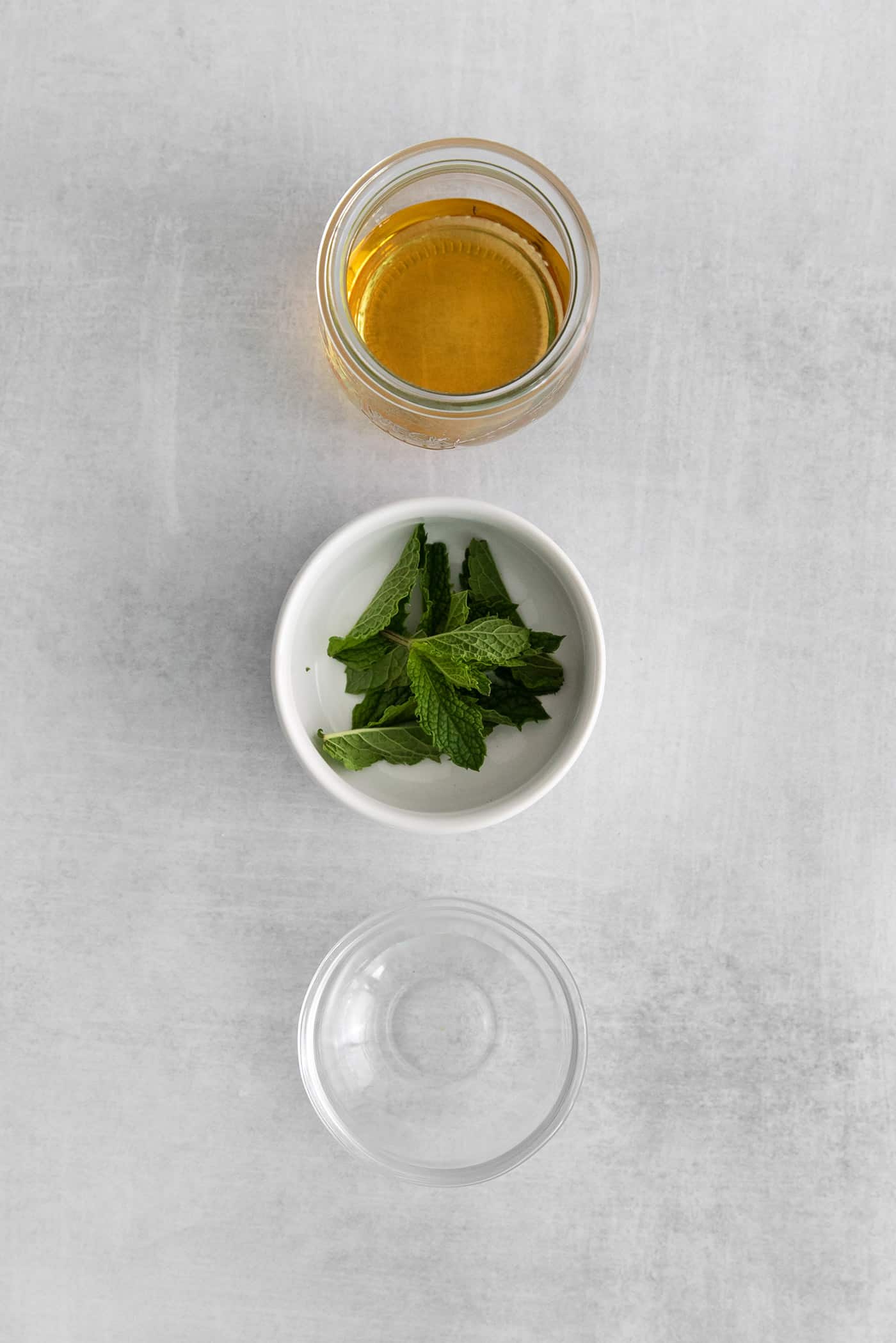 bourbon, fresh mint leaves, and simple syrup