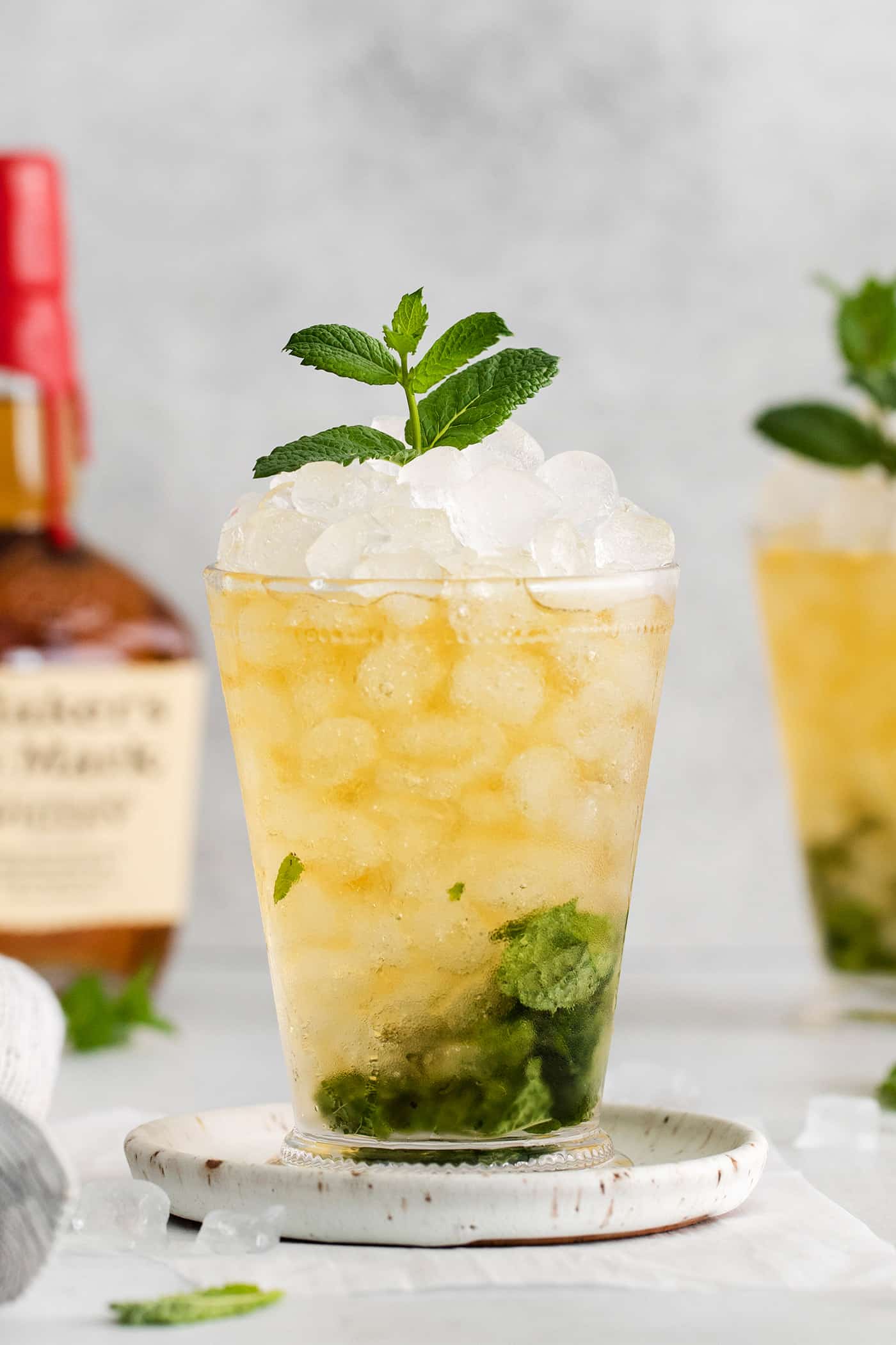 A cocktail made with bourbon, mint, and simple syrup