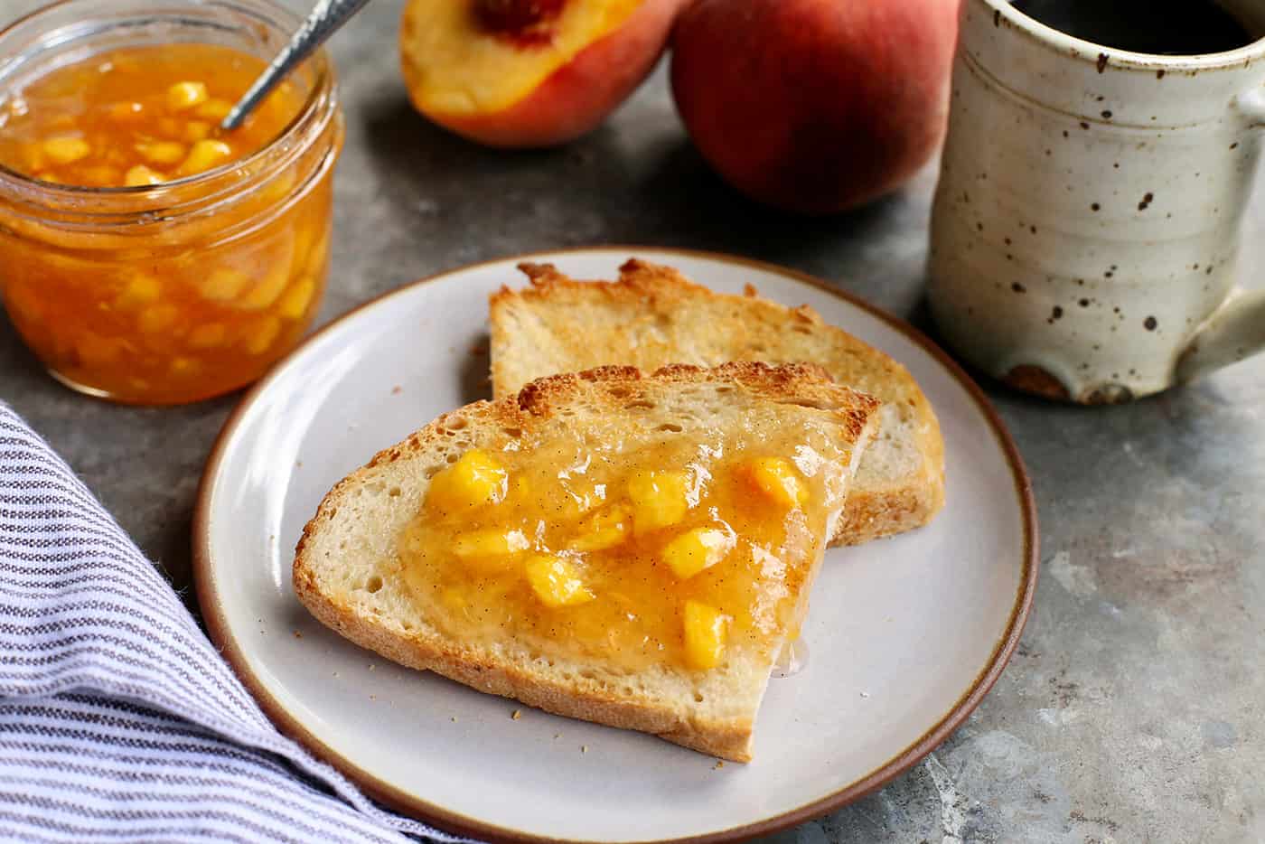 peach jam spread on a slice of toast