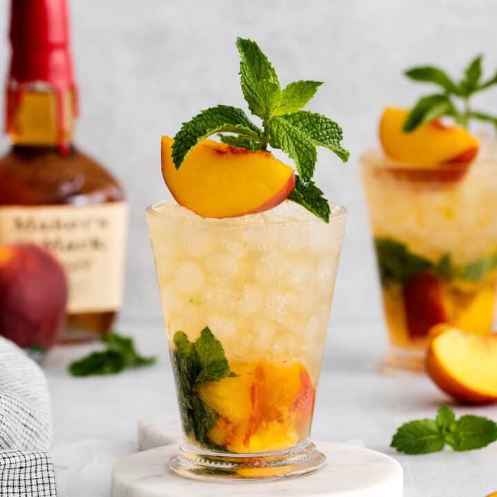 A peach mint julep cocktail
