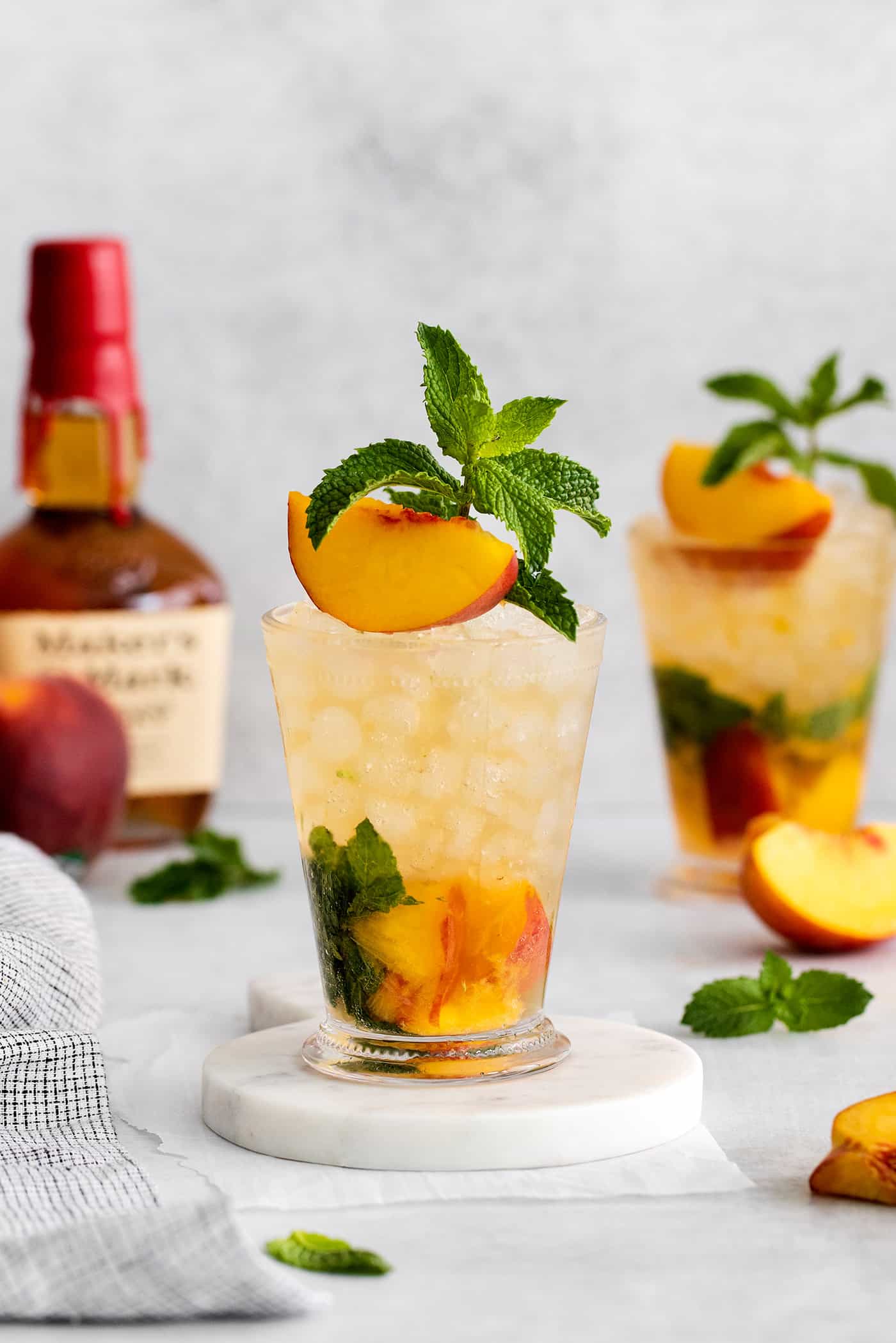 Two peach mint julep cocktails