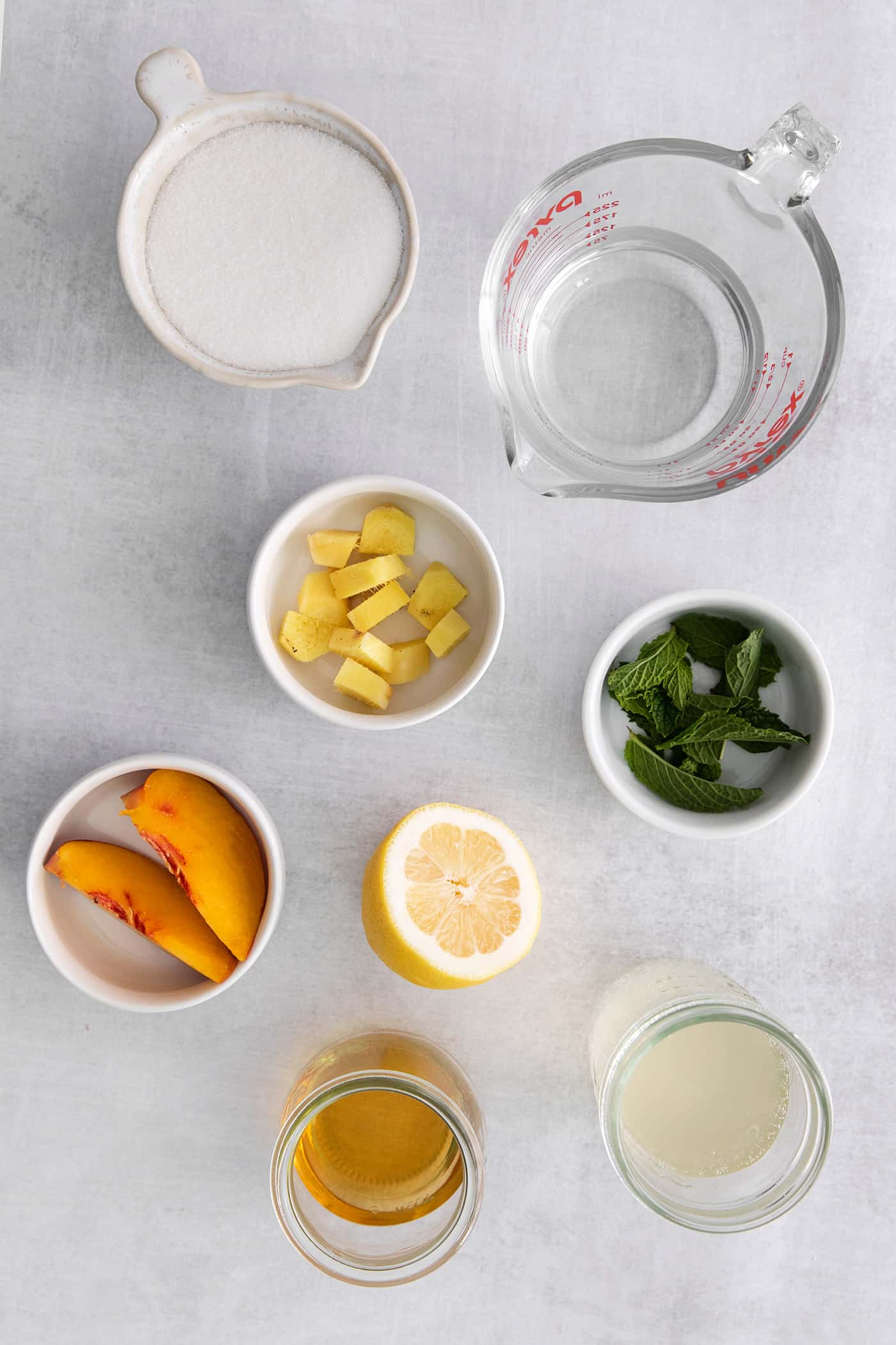 Overhead view of peach mint julep ingredients