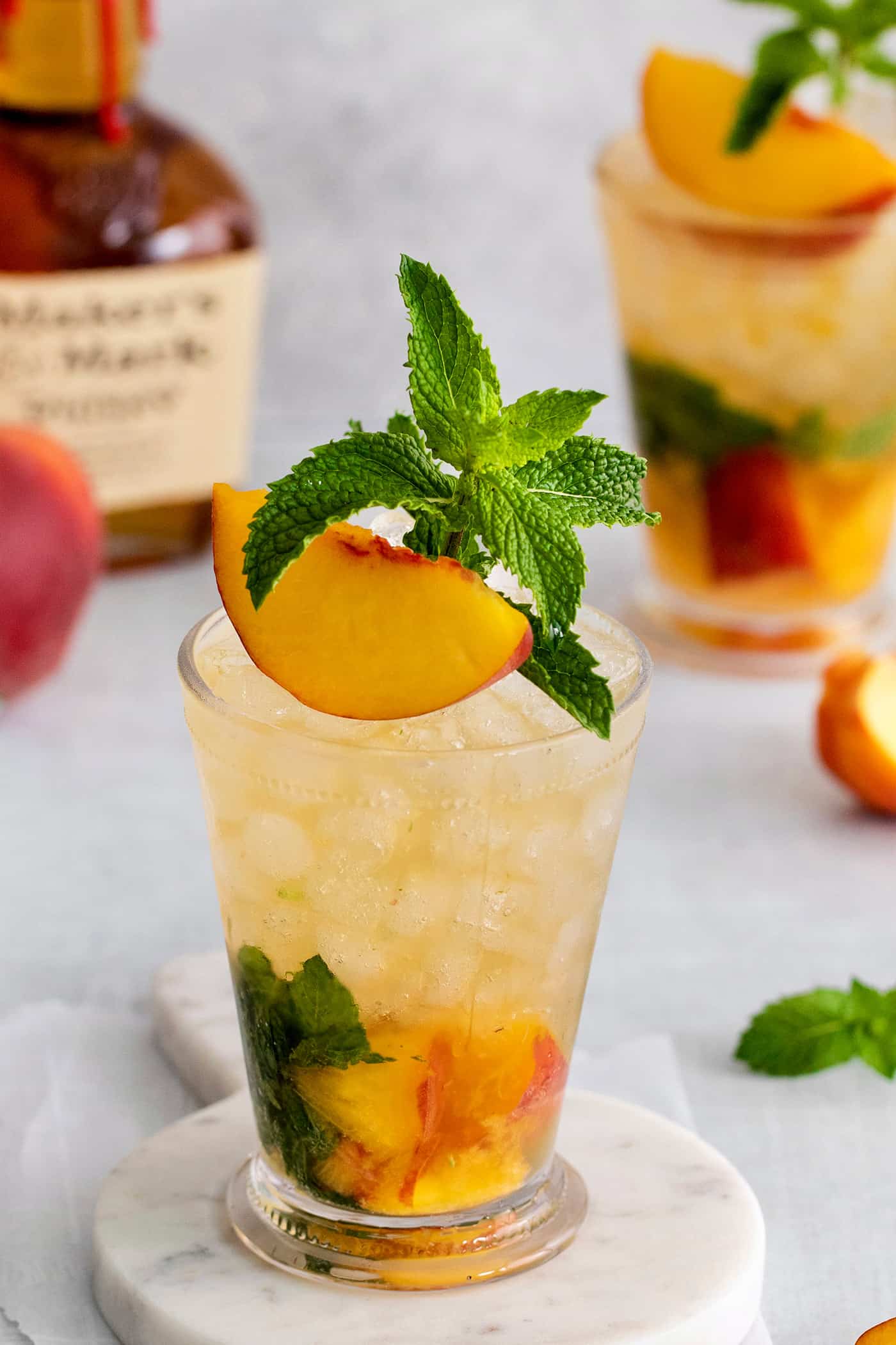 Angled overhead view of a peach mint julep