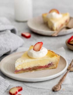 a slice of rhubarb cheesecake pie on a plate