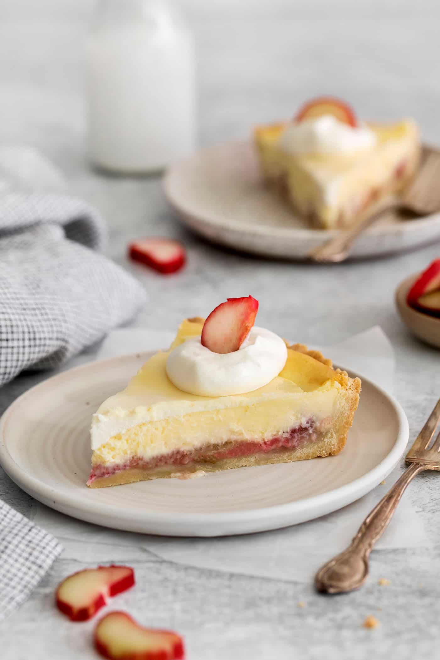 a slice of rhubarb cheesecake pie on a plate