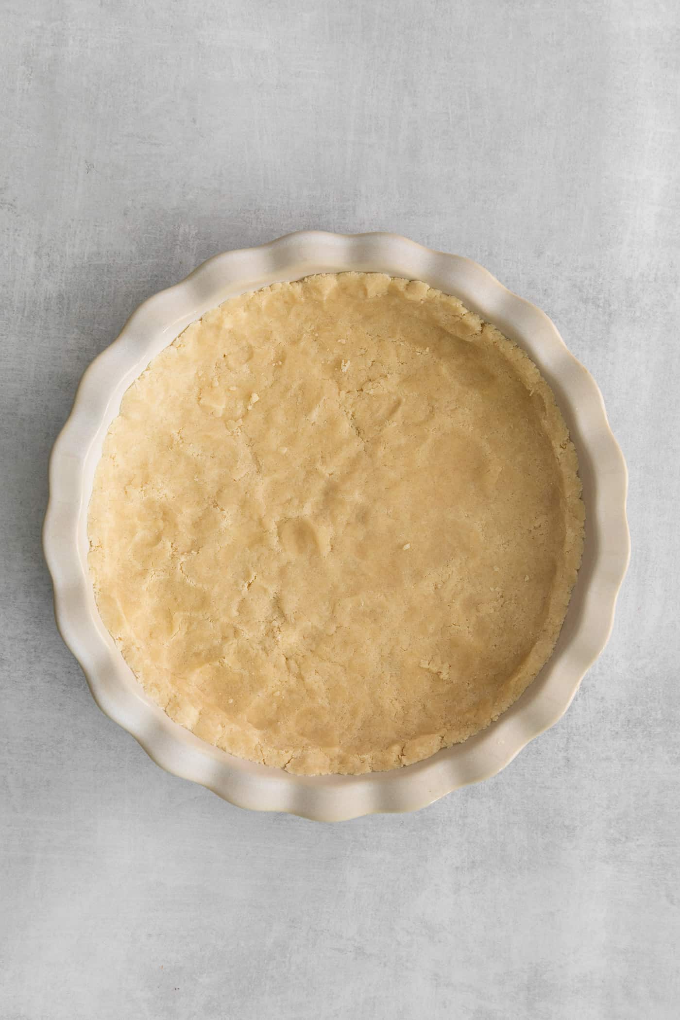 crust pressed into a white pie plate