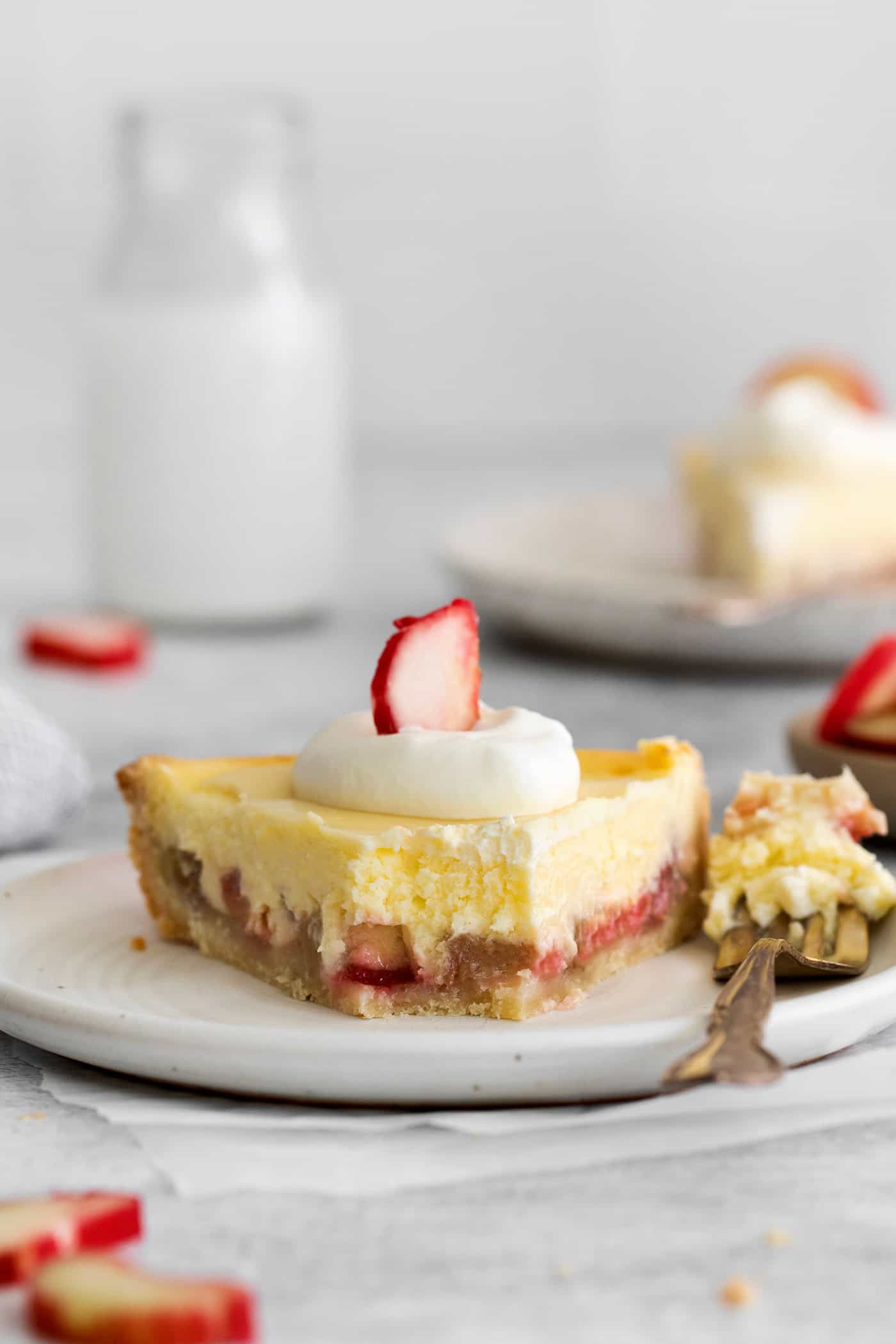 a close-up of a piece of pie with a forkful removed