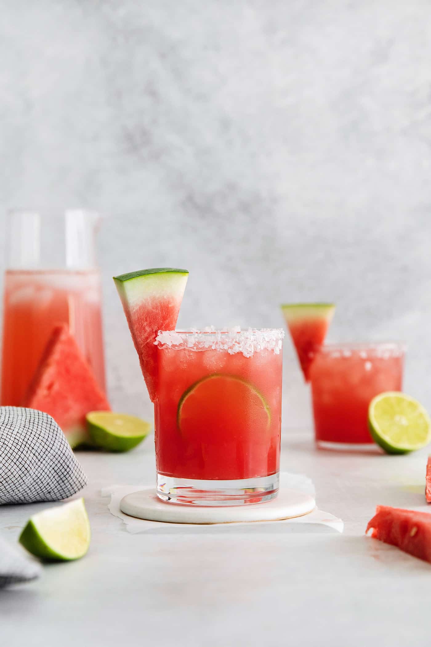 a salt-rimmed glass of watermelon margarita