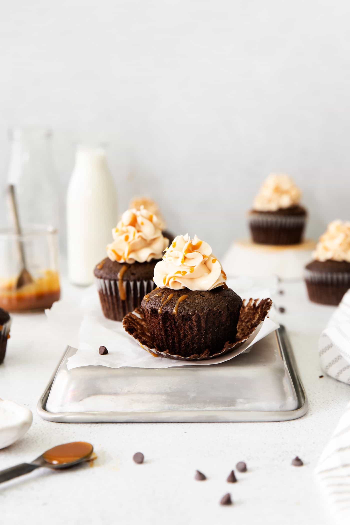 chocolate cupcake with the paper liner pulled away, ready to eat