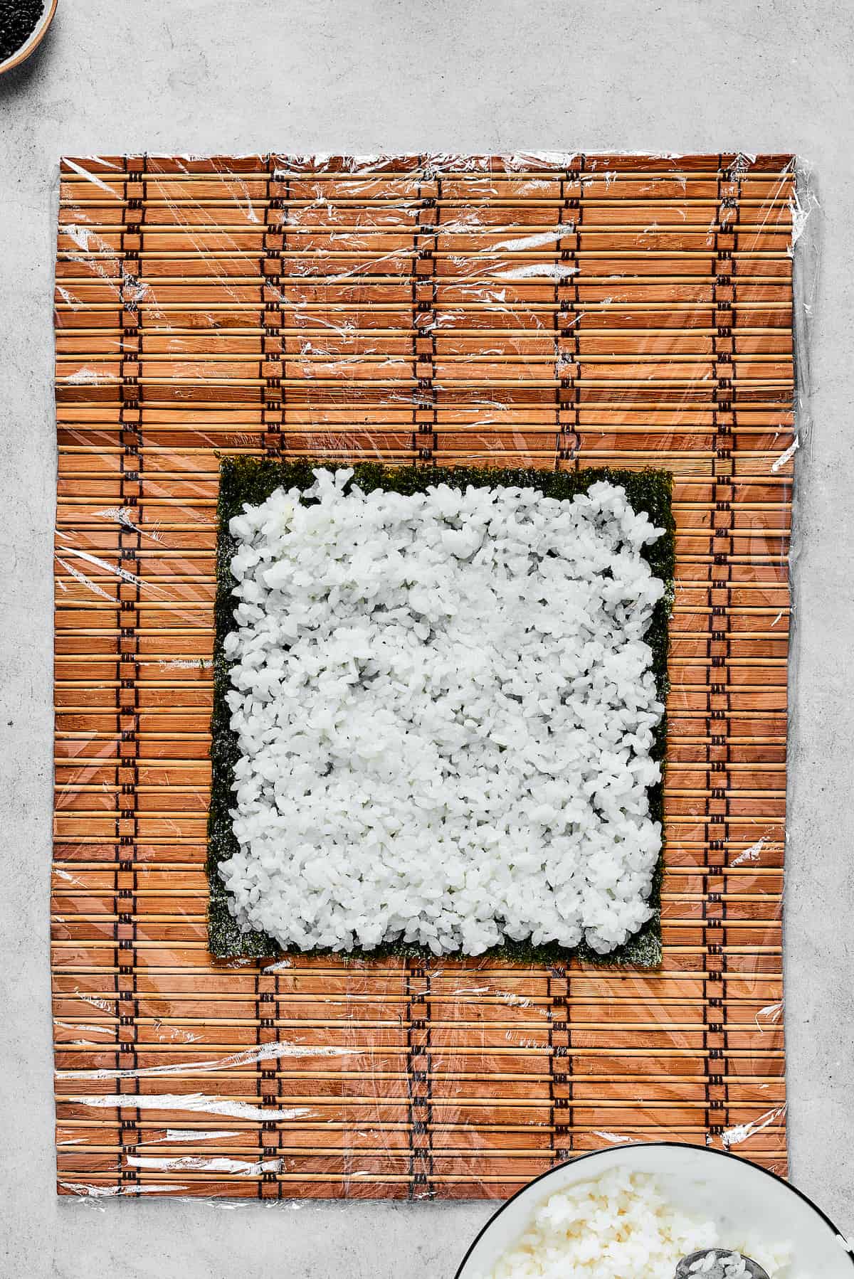 Sushi rice on a sheet of nori