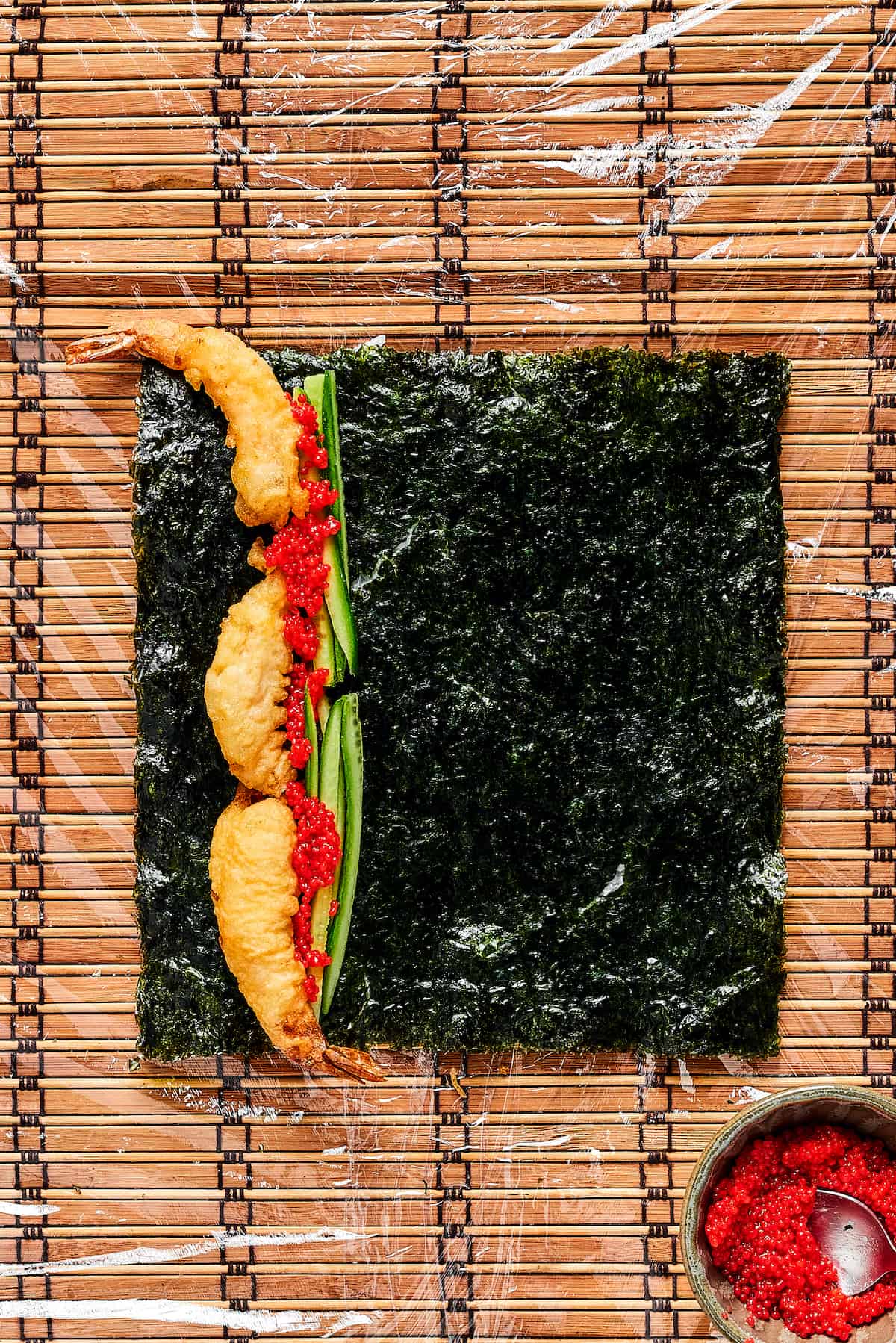 Cucumber, shrimp, and tobiko on a sheet of nori