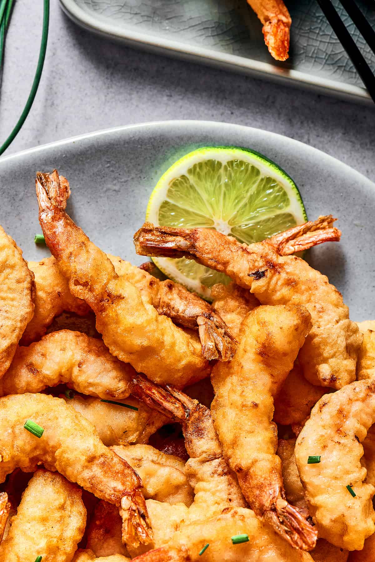 A pile of tempura shrimp on a plate