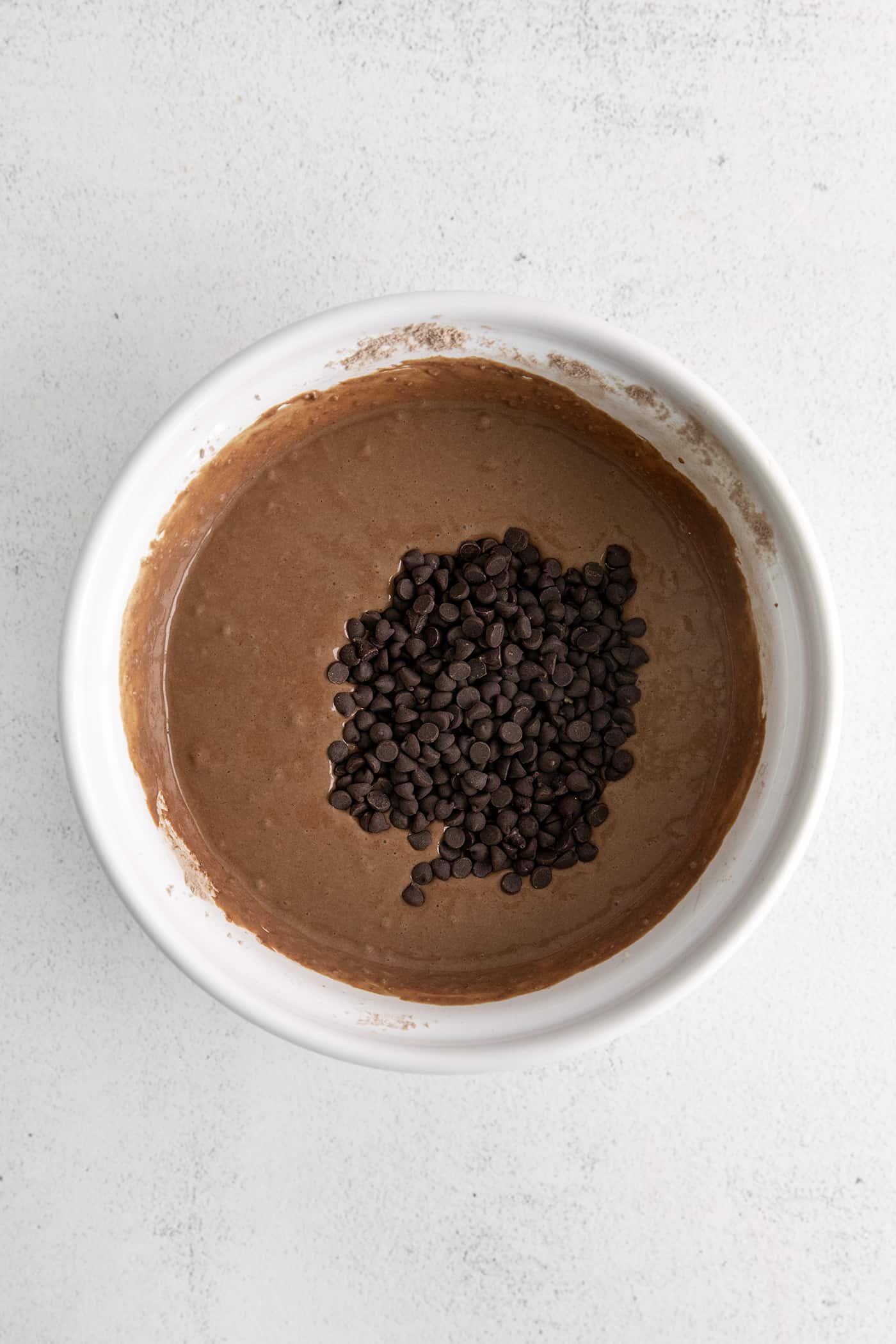 Chocolate pancake batter in a white bowl