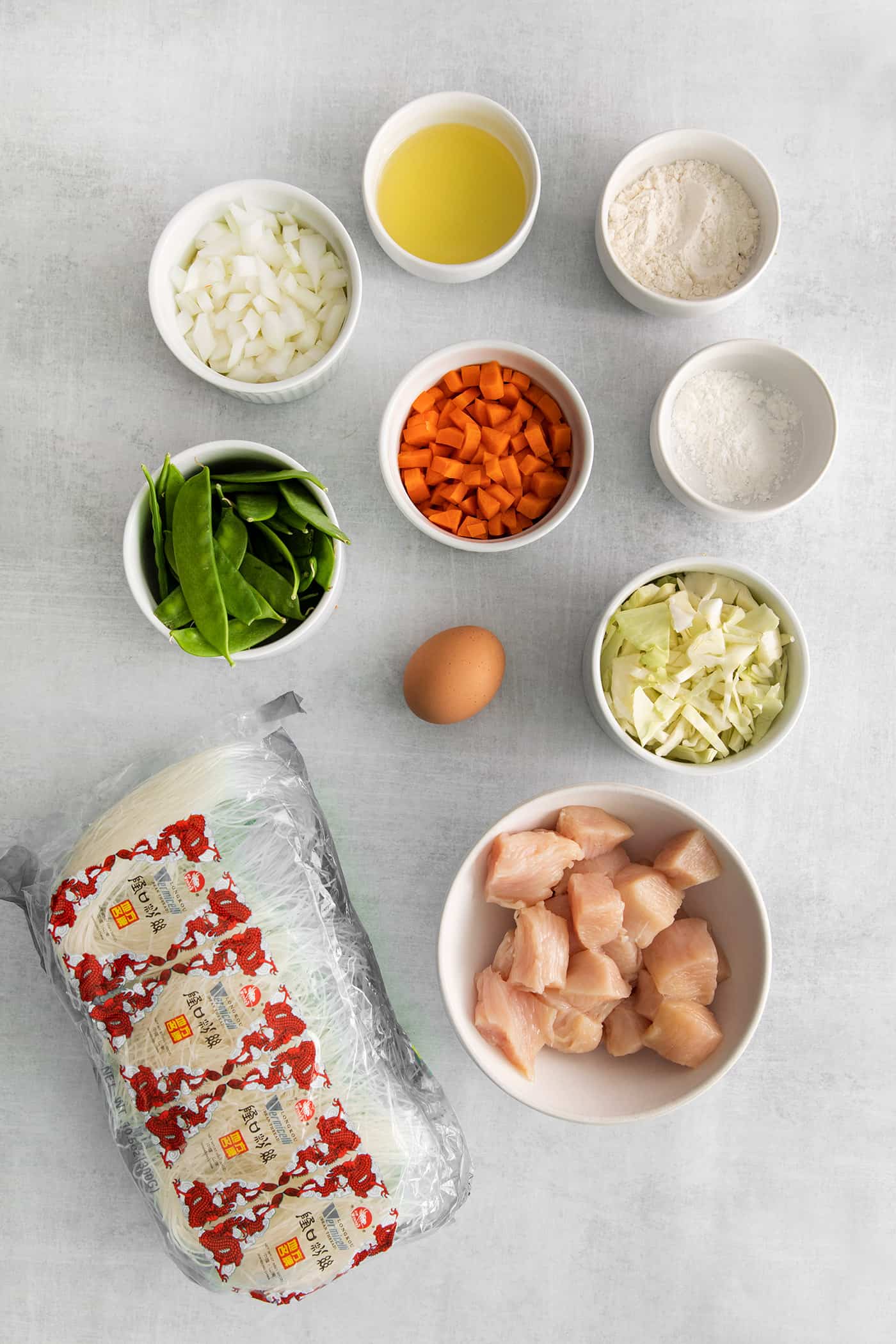 Overhead view of ingredients for chicken pad woon sen