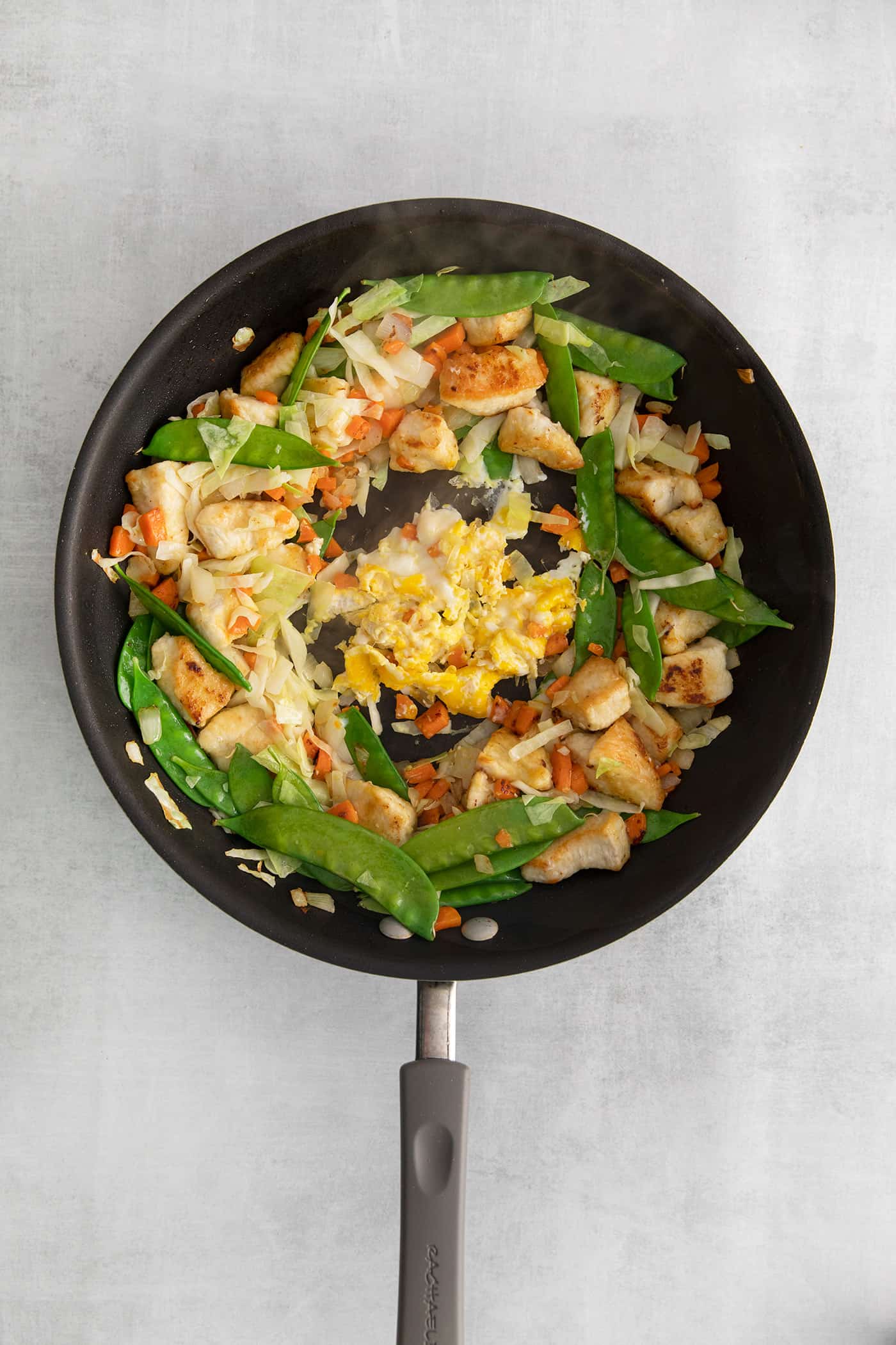 Chicken stir fry with egg in the center