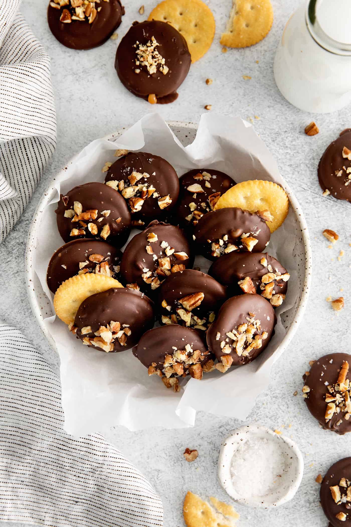 Made with 6 ingredients, Ritz Turtles are a fun, easy treat. These Ritz cracker caramel cookies are sweet, salty, crunchy & chewy all in one. overhead view of a bowl of Ritz turtles