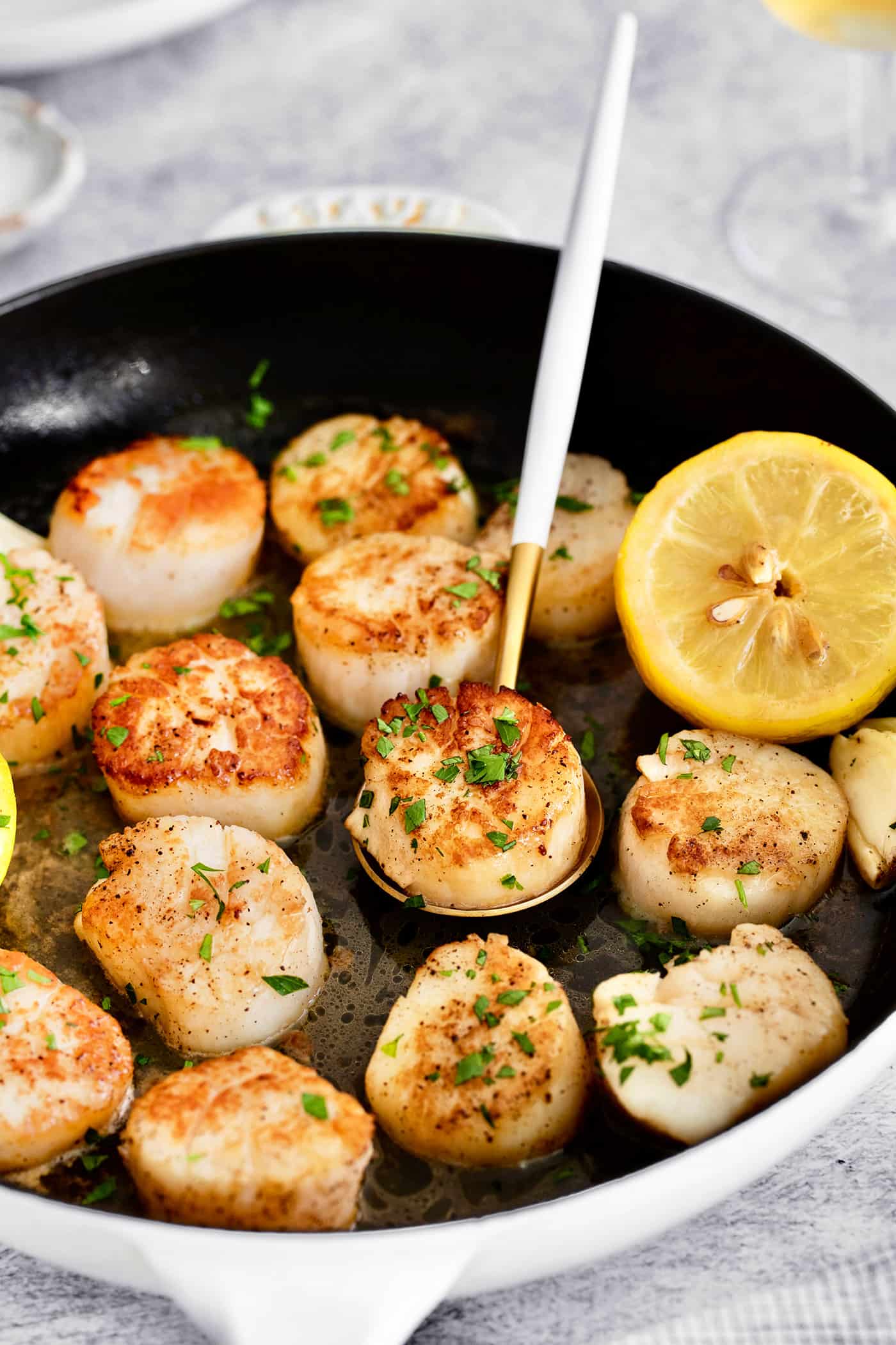 Lemon garlic scallops in a skillet