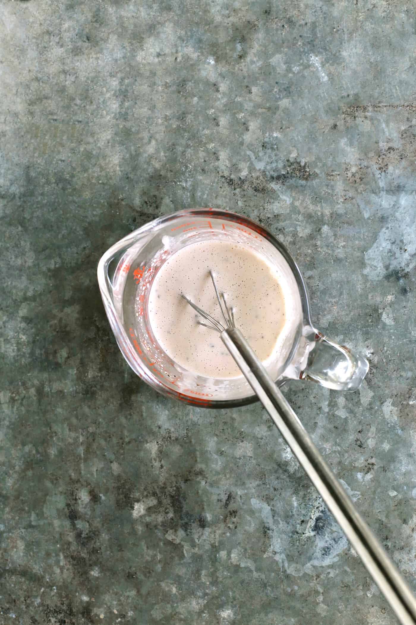 Coleslaw dressing in a small bowl