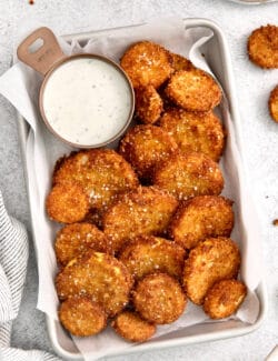 Overhead view of fried squash with a dish of ranch