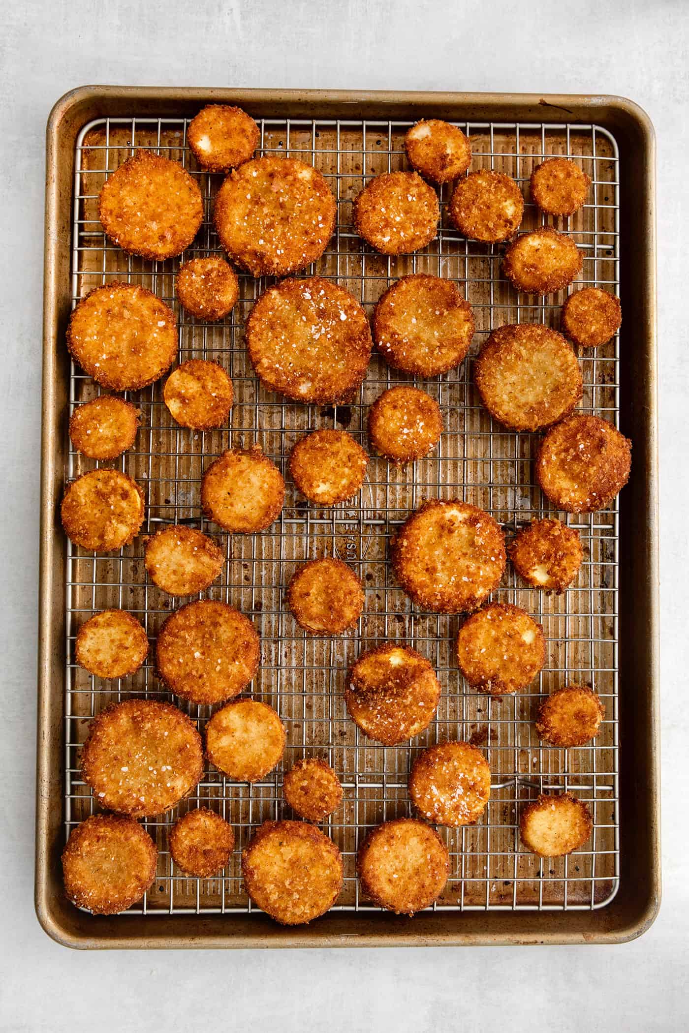 Overhead view of fried squash on a wire rack