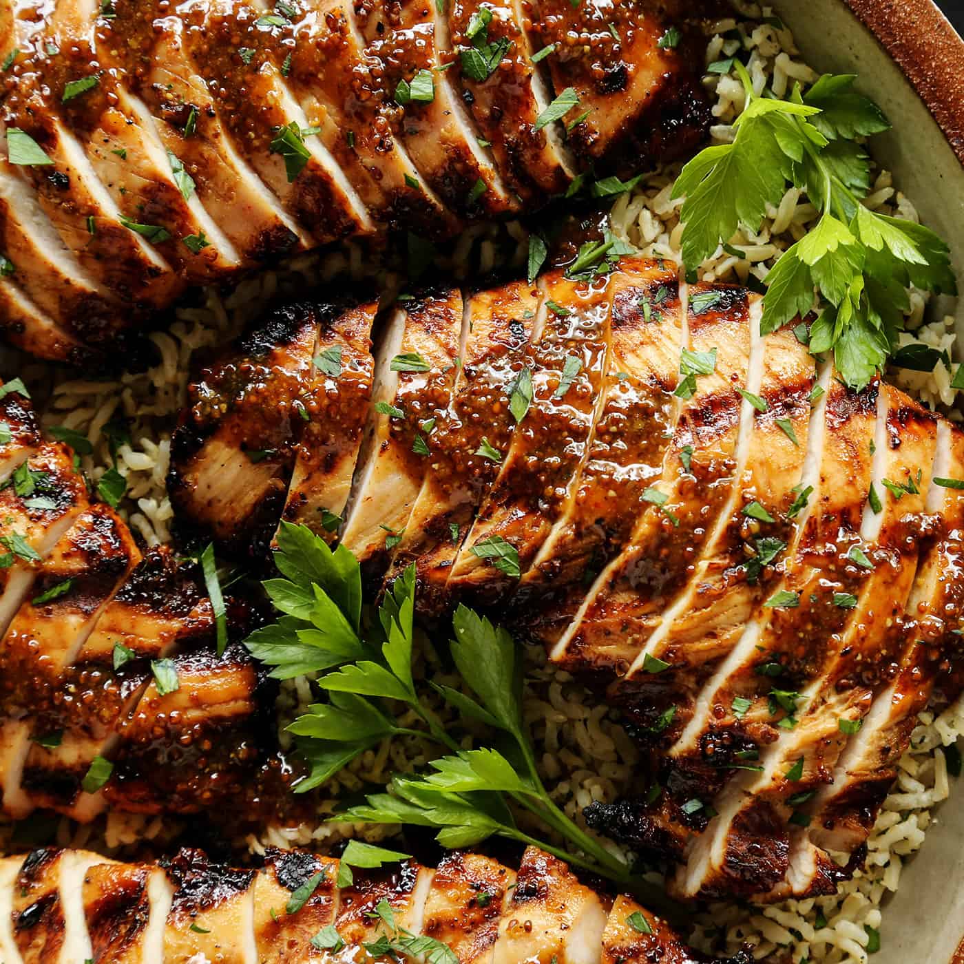 turkey tenderloins that are grilled and sliced, with a brown sugar and whole grain mustard sauce