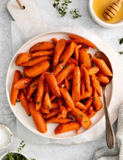 overhead view of honey garlic carrots on a white plate