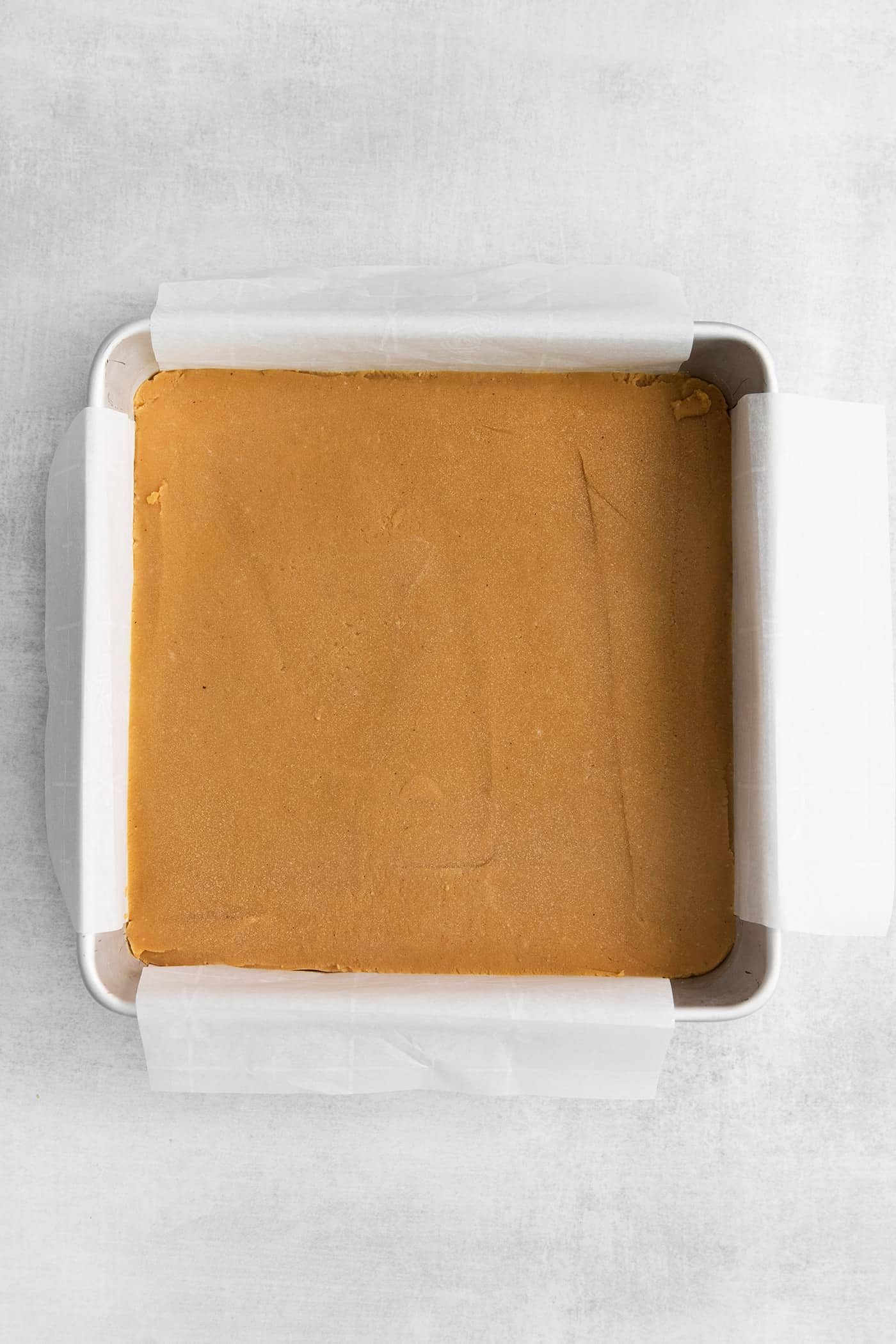 Peanut butter fudge in an 8x8 pan