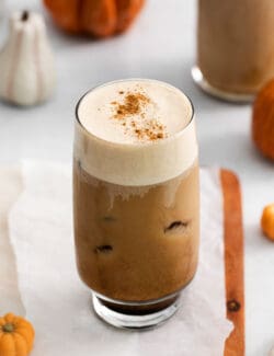 A pumpkin cream cold brew in a glass