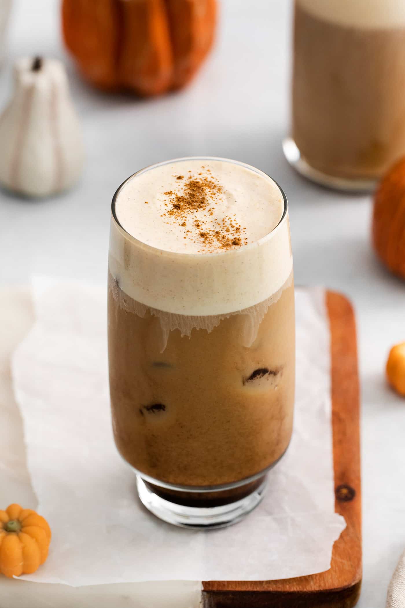 A pumpkin cream cold brew in a glass