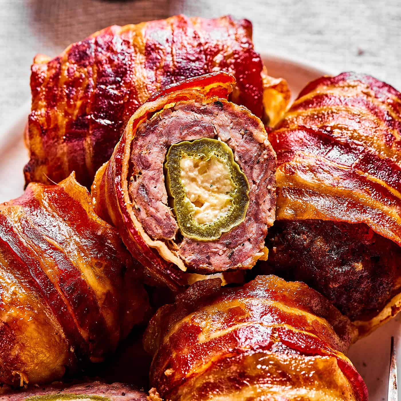bacon and sausage wrapped stuffed jalapenos