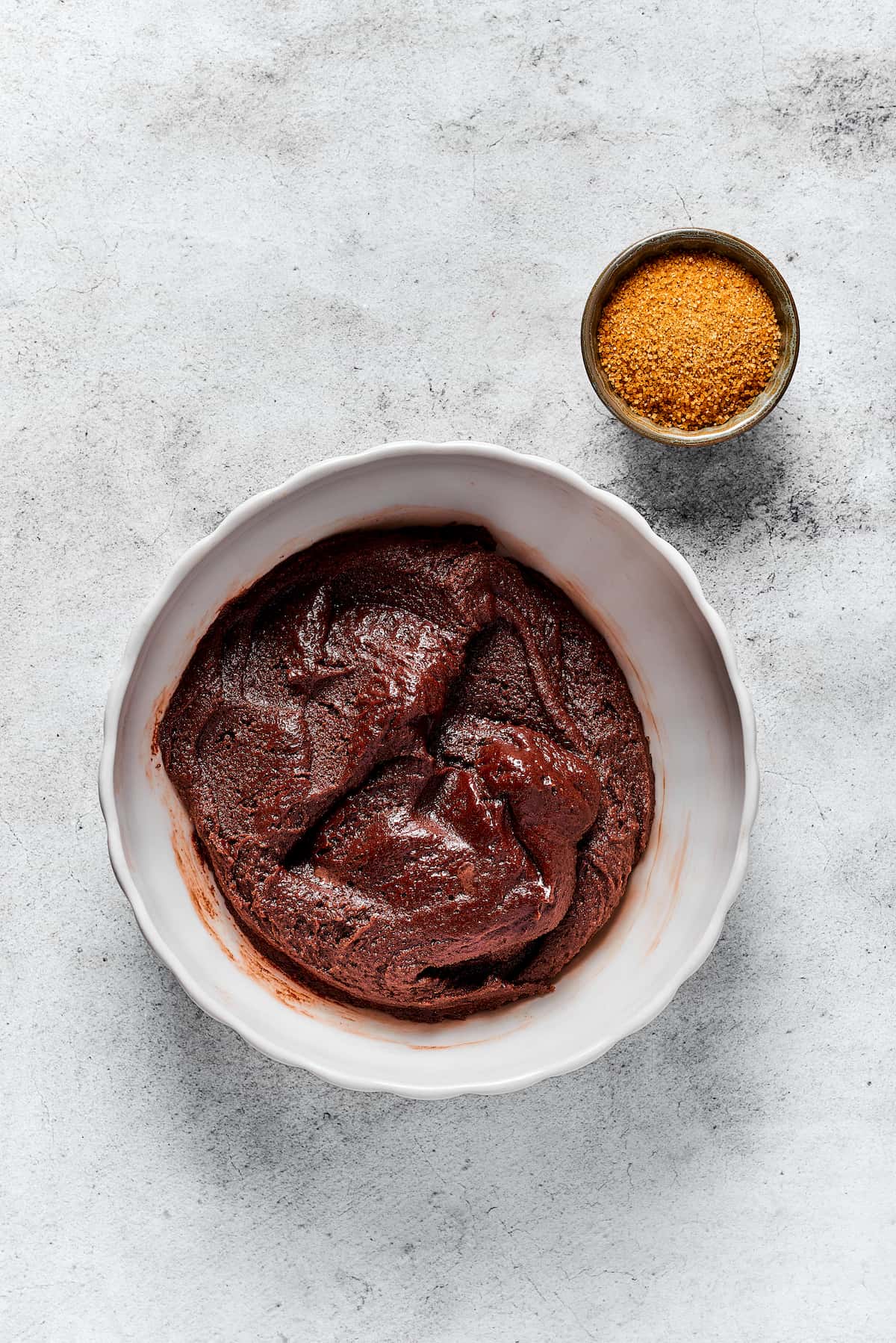 These Espresso Cookies are soft and chewy, with a delightfully rich chocolate flavor and just a hint of espresso. Just 10 ingredients! Chocolate cookie dough in a white bowl