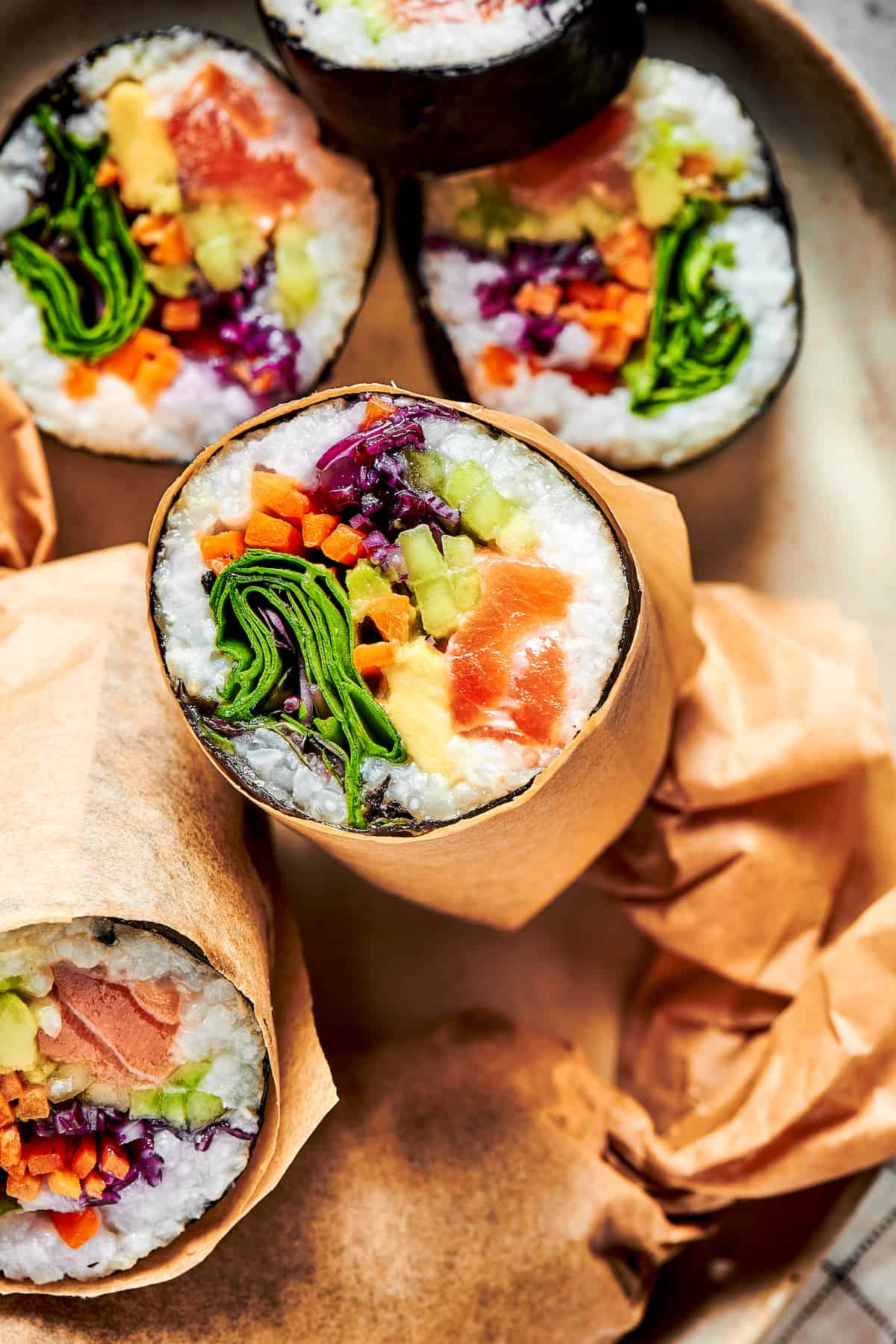 Close up of a sushi burrito cut in half