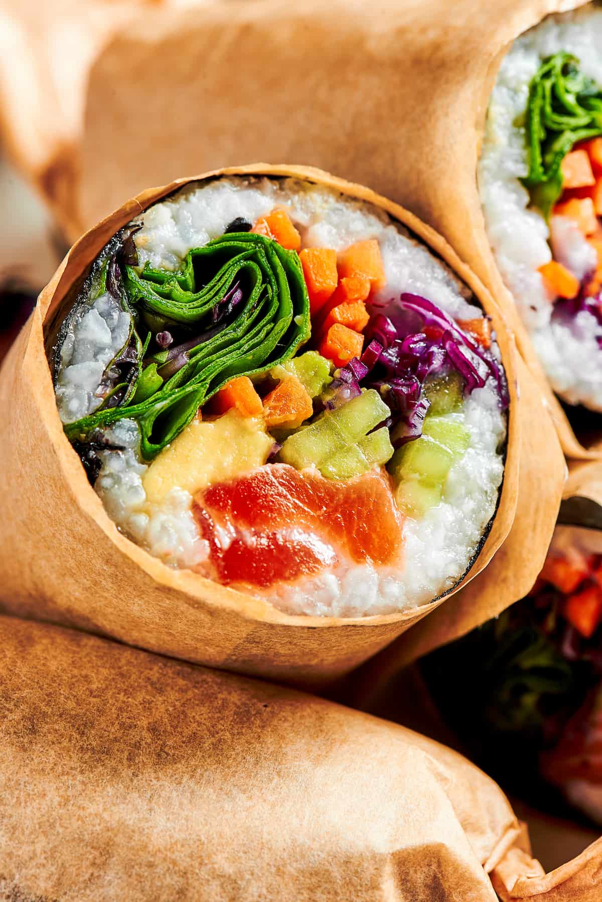 Close up of half of a sushi burrito
