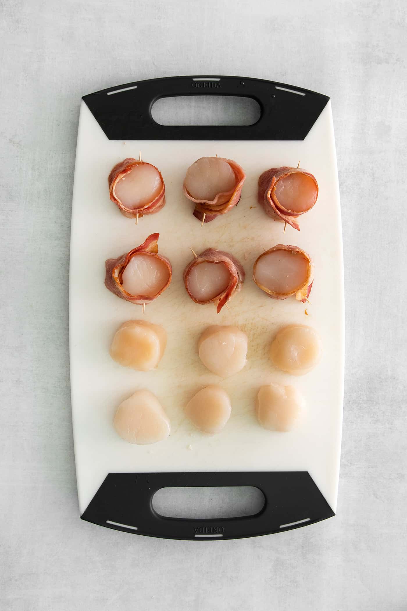 Overhead view of scallops on a cutting board