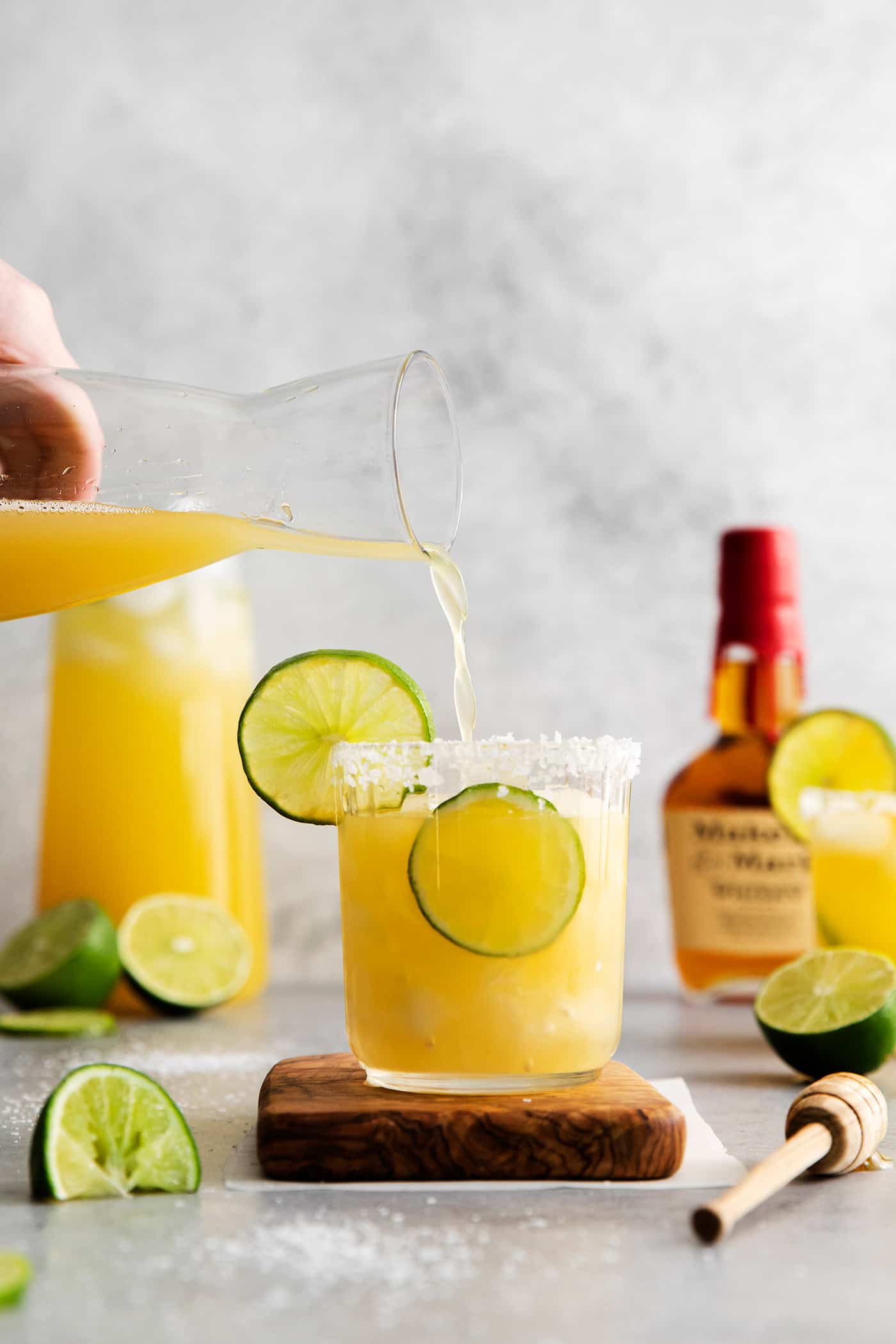 Bourbon margarita being poured into a glass