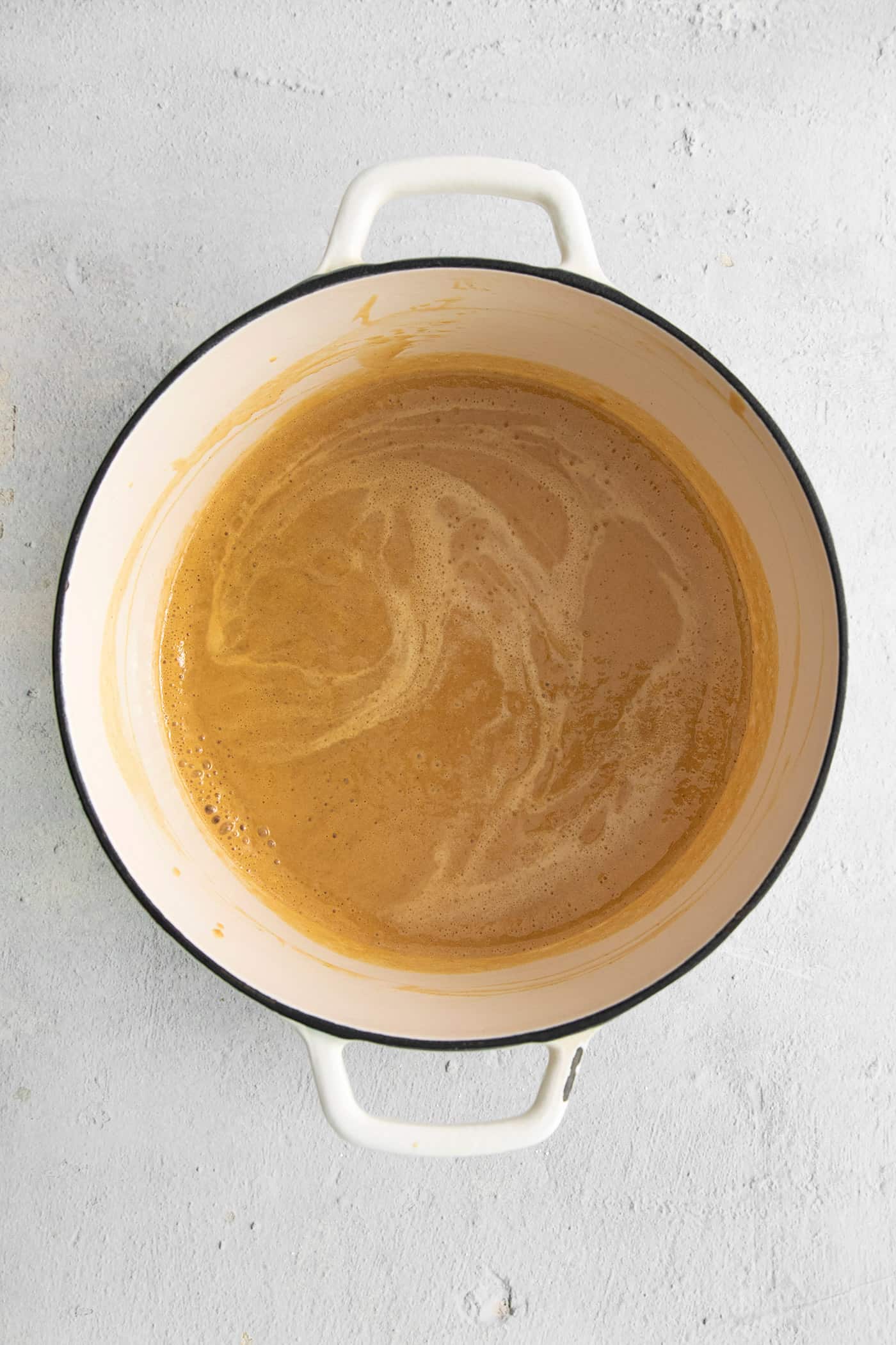 Melted peanut butter mixture in a saucepan