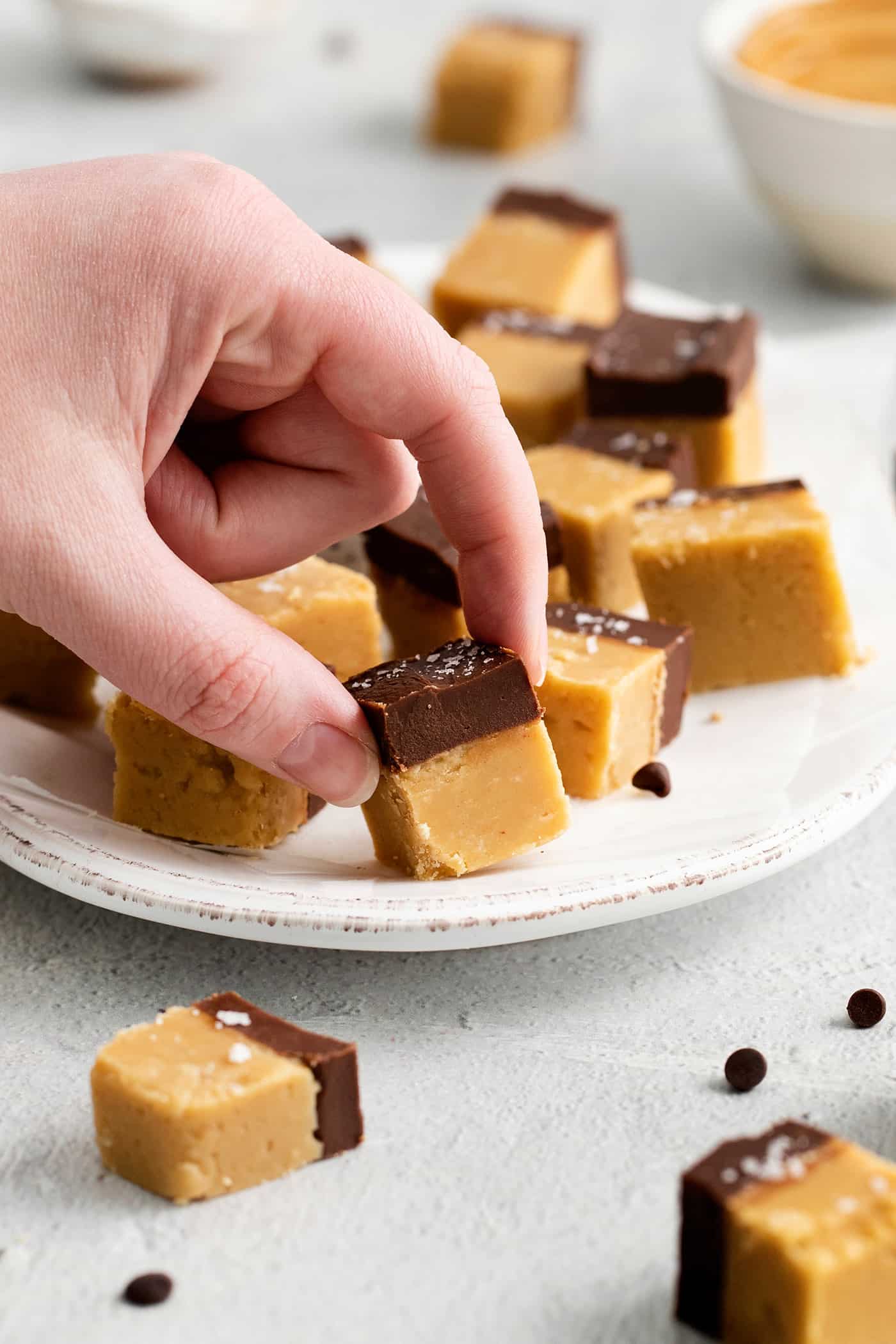 Fingers grabbing a piece of buckeye fudge