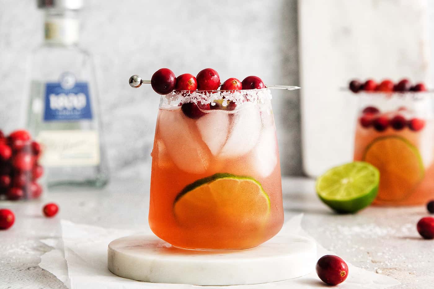 A cranberry margarita on a white coaster