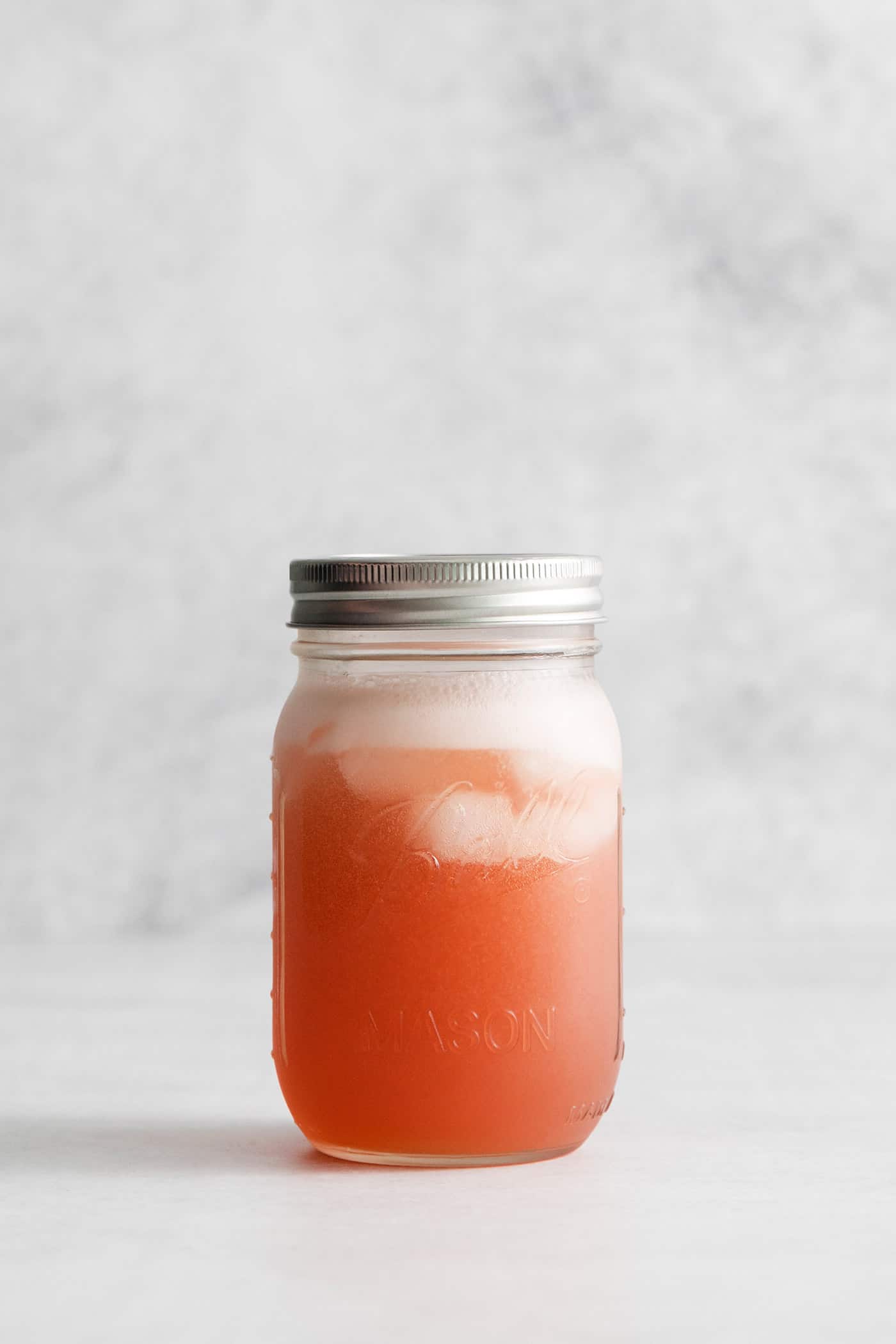 Cranberry margarita in a mason jar