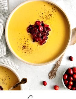 Pinterest image for creamy squash soup with cranberry relish