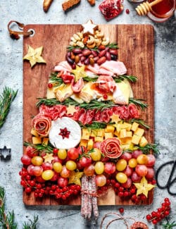 a charcuterie board for the holidays, with ingredients in the shape of a Christmas tree