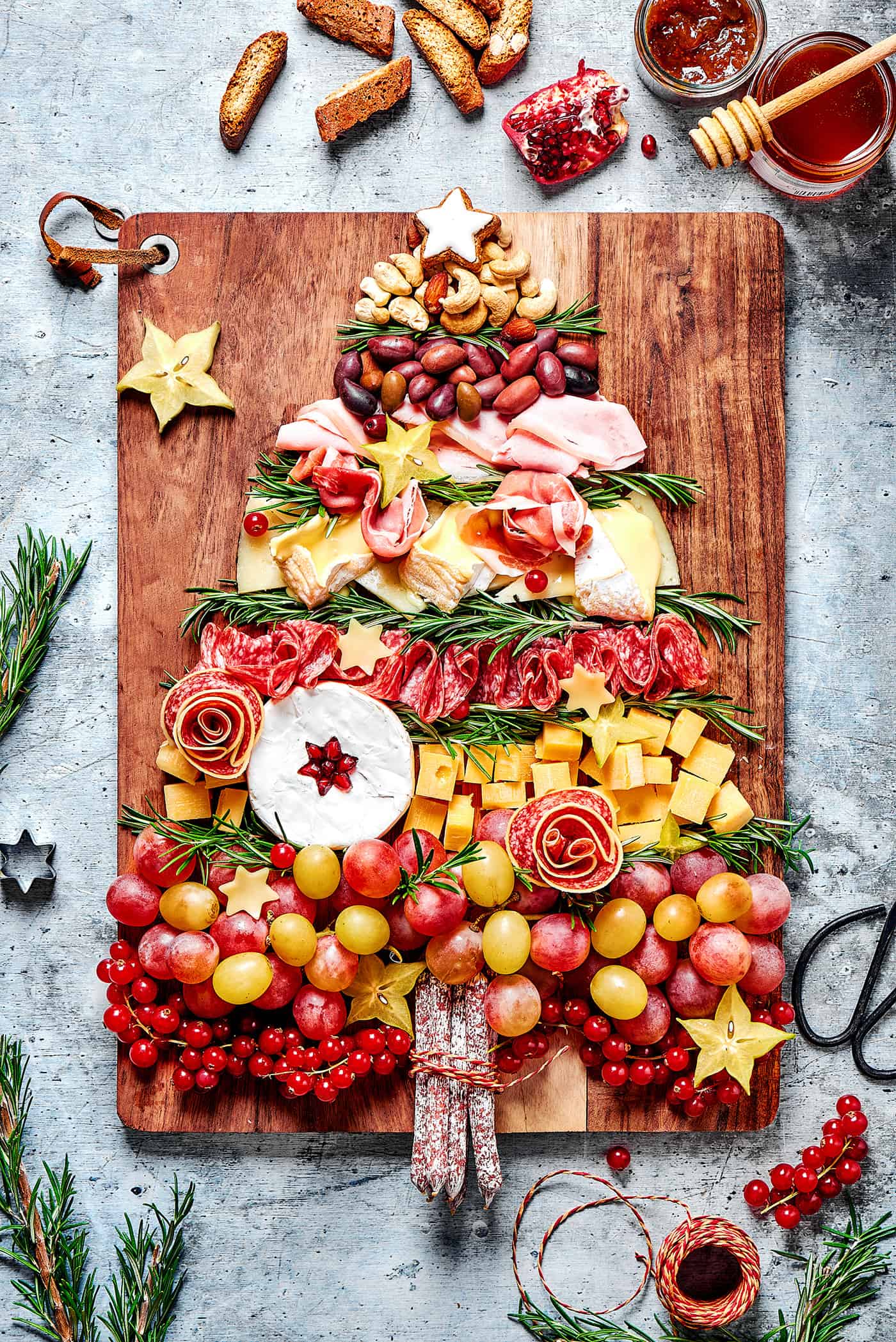 a charcuterie board for the holidays, with ingredients in the shape of a Christmas tree