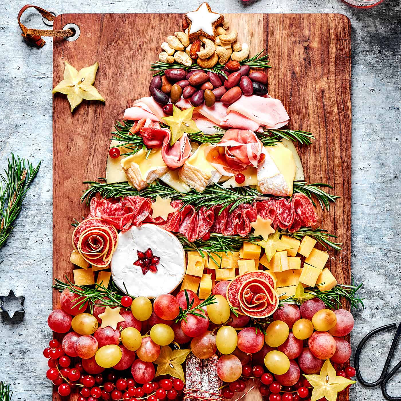 a charcuterie board in the shape of a pine tree