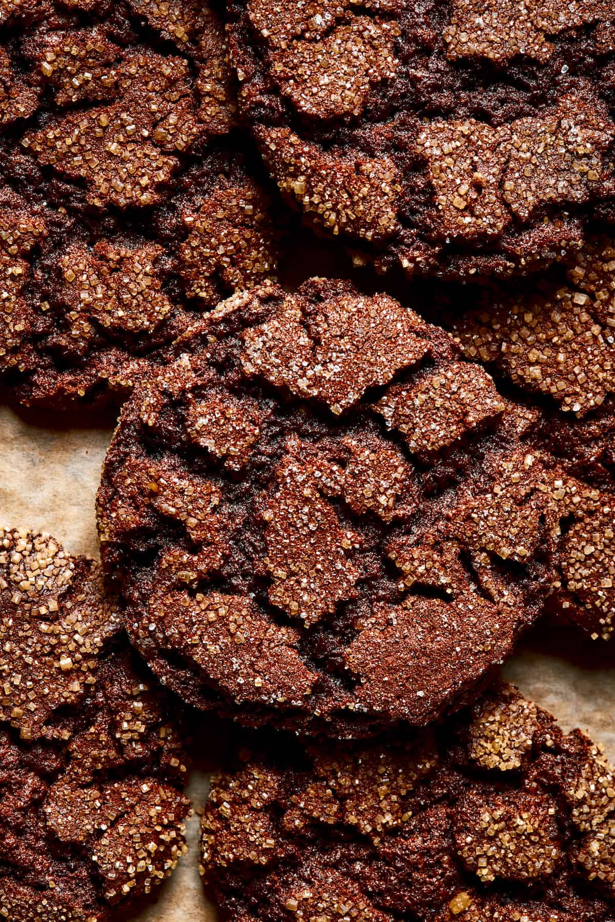 espresso cookies piled on a baking sheet